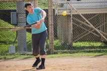 Cpl. Allen Chandler swings a bat during a softball game during the fourth annual Reindeer Games on Camp Kinser, Okinawa, Japan, Dec. 18, 2018. The Reindeer Games are a holiday-themed, family event held to boost morale and camaraderie among the Marines, Sailors and families of Combat Logistics Regiment 37, 3rd Marine Logistics Group. Chandler, a native of Orlando, Florida, is a wideband repairer with Maintenance Platoon, Communications Company, CLR-37, 3rd MLG. (U.S. Marine Corps photo by Lance Cpl. Terry Wong)