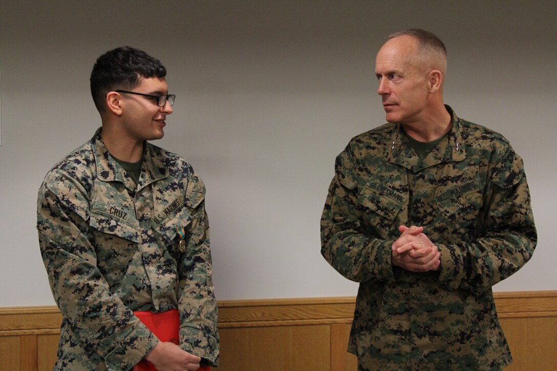 CAMP HUMPHREYS, Republic of Korea – Sgt. Eric Cruz, G4 embarkation non-commissioned officer, receives the Navy and Marine Corps Achievement Medal here, Dec. 19. Cruz received the medal for his role in displacing U.S. Marine Corps Forces Korea from USAG Yongsan to Camp Humphrey, which included leadership within the team responsible for moving the command and maintaining accountability for millions of dollars’ worth of equipment. (Official U.S. Marine Corps photo by Sgt. Nathaniel Hanscom)