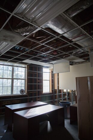An office space inside the II Marine Expeditionary Force Headquarters building at Camp Lejeune, N.C., Dec. 11, 2018, normally occupied by several Marines, remains empty following the aftermath of Hurricane Florence. Extensive flooding and strong winds required contractors to remove damaged drywall and ceiling tiles. Three months after Hurricane Florence, damage can still be seen at various places inside the building. Despite the devastation, Marines continue to utilize these workspaces or condense into other office areas with less damage. (U.S. Marine Corps photo by Cpl. Austyn Saylor)