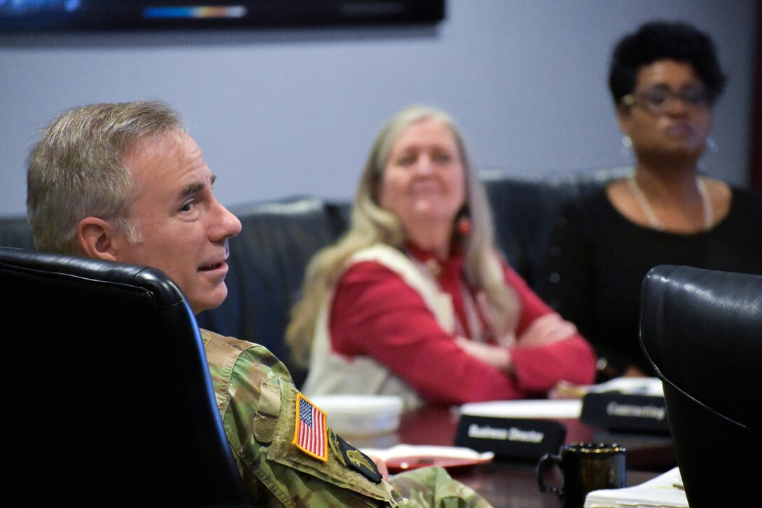 U.S. Army Colonel John Hurley, commander of the U.S. Army Engineering and Support Center, Huntsville, listens to project updates during a monthly Project Review Board at the Center in Huntsville, Alabama, Dec. 12, 2018.