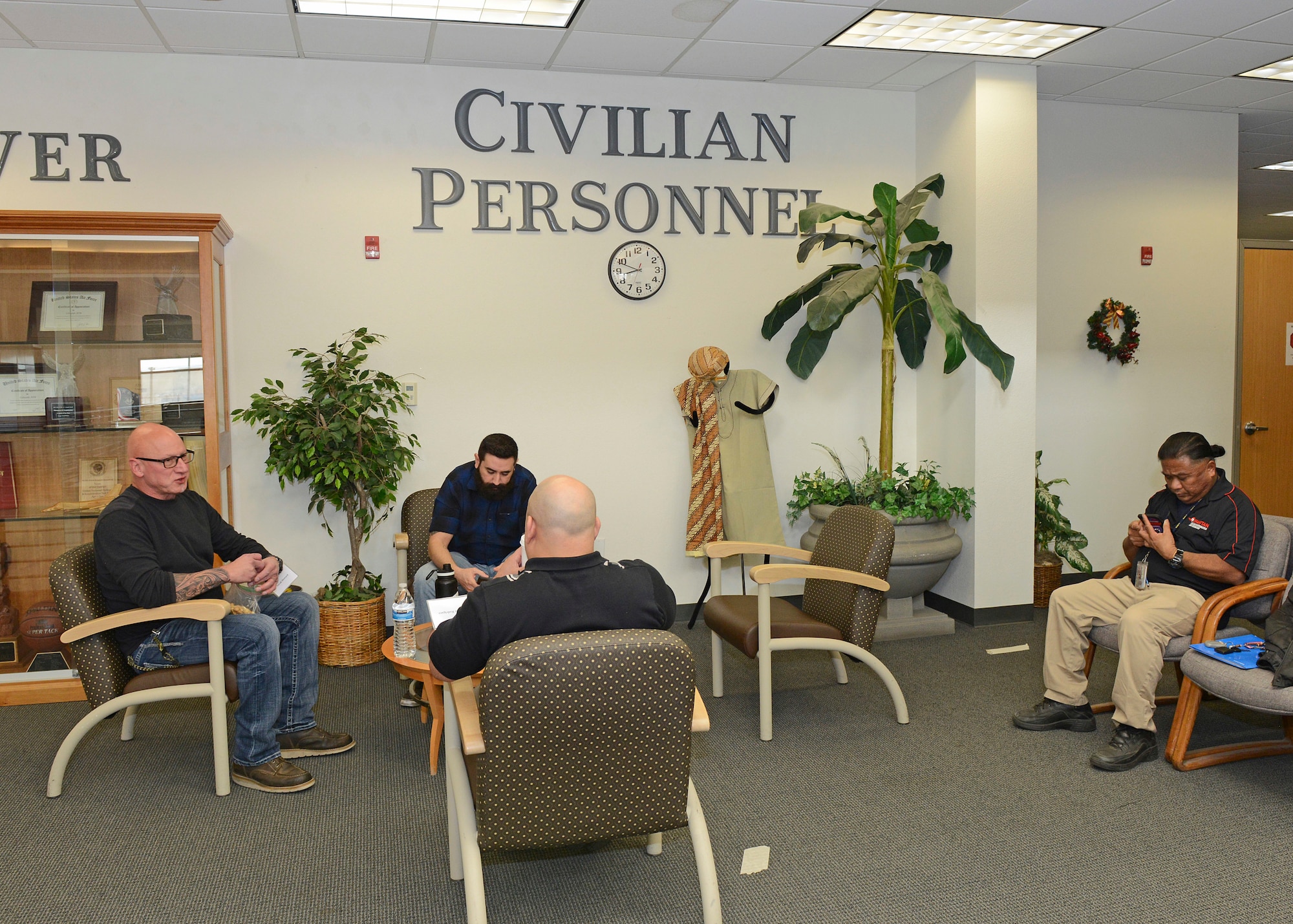 Maintenance job candidates sit in the waiting area on the second floor of Bldg. 3000 Dec. 13. The 412th Test Wing held a one-day direct hiring event where suitable job candidates were invited to Edwards to interview and conduct pre-employment requirements all in one day. (U.S. Air Force photo by Kenji Thuloweit)