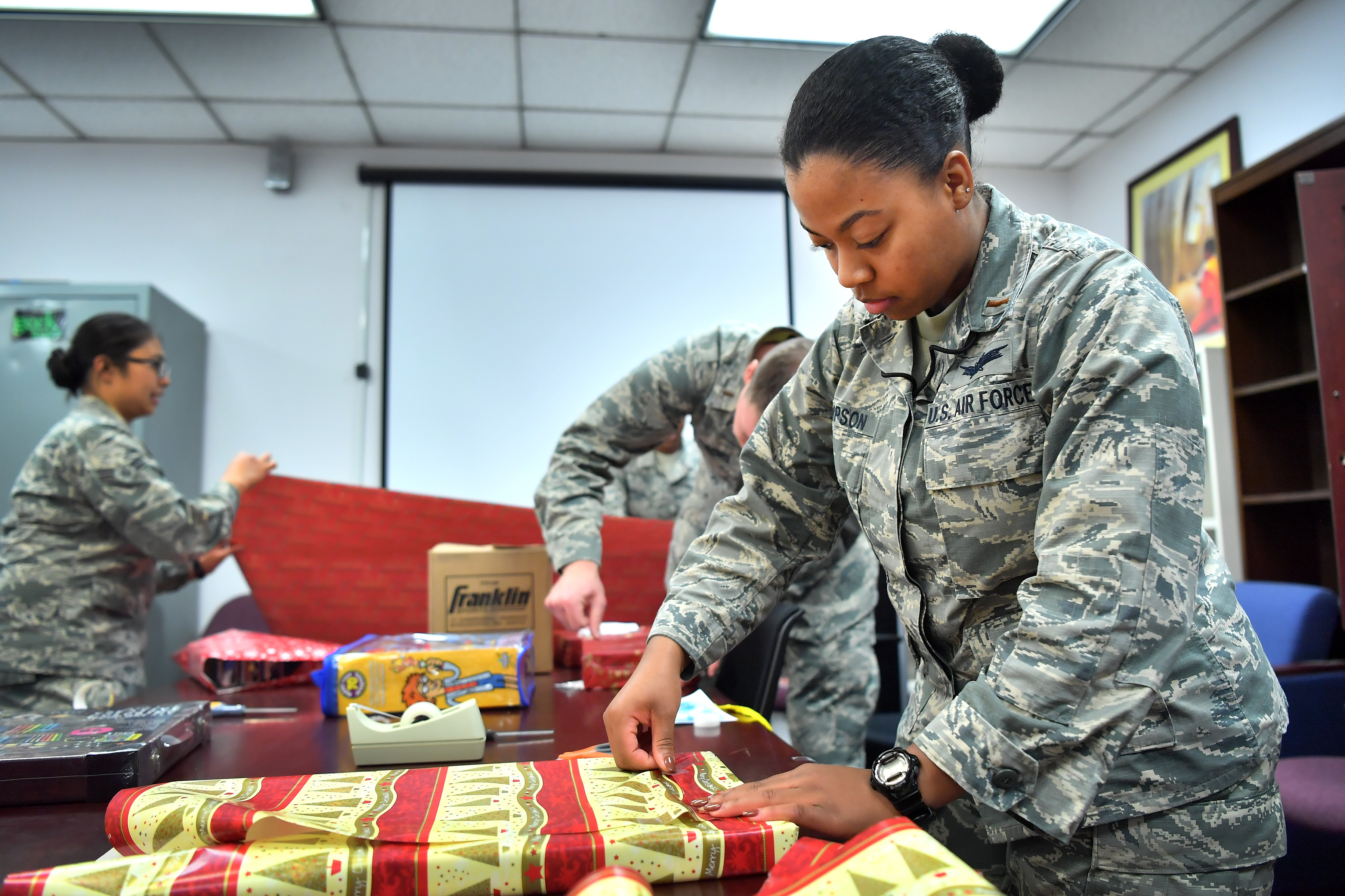 50th-space-wing-volunteers-wrap-angel-tree-gifts-schriever-space