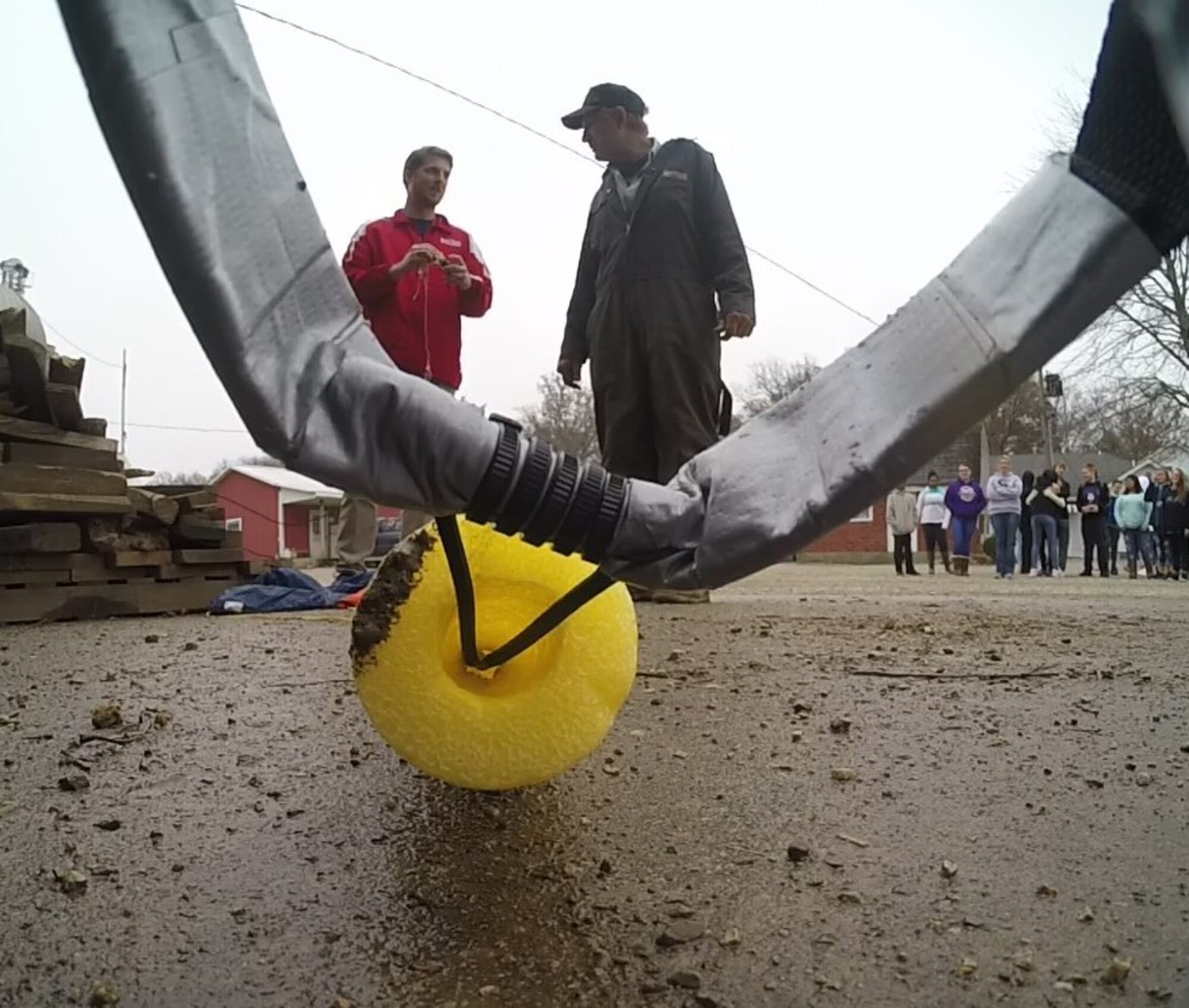 Joshua Strausbaugh, Belle Valley School science teacher, speaks with a local farmer in Mount Carmel, Illinois after his students travelled 140 miles to recover their high-altitude computer, launched in Belleville, Illinois, which analyzed data ranging from altitude and coordinates traveled to temperature and pressure, Nov. 30, 2018.  In the end, the balloon reached a maximum altitude of 22.5 miles and recorded a temperature low of 67 degrees Fahrenheit. The balloon launch was made possible through an Air Force science, technology, engineering, and mathematics grant.