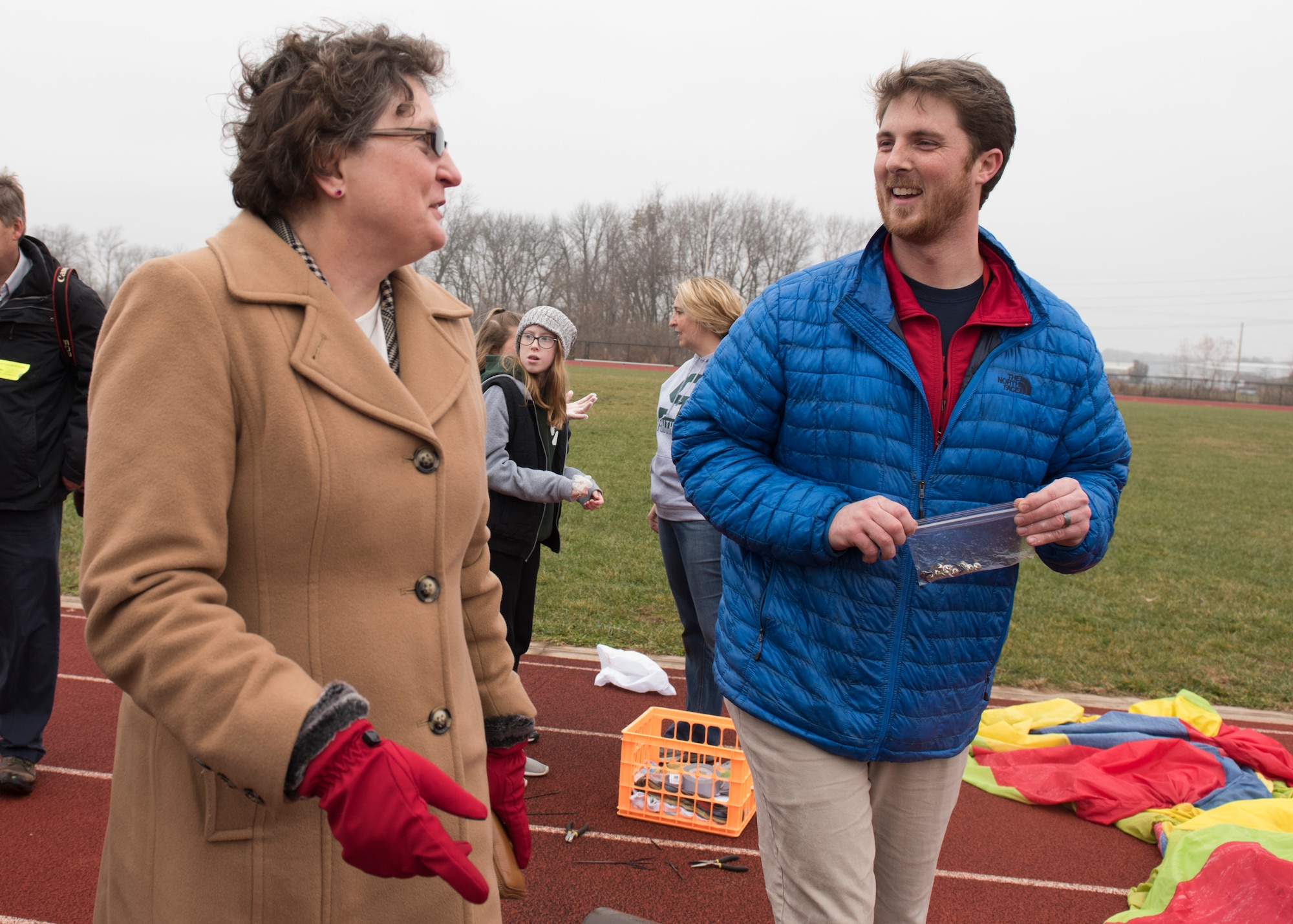 Dr. Donna Senft Air Mobility Command chief scientist, speaks with Joshua Strausbaugh Belle Valley School science teacher, after his eighth graders executed their year-long science, technology, engineering, and mathematics project made possible through an Air Force STEM grant, Nov. 30, 2018, Belleville, Illinois. Senft worked with the Scott Air Force Base school liaison officer to approve the grant.  Three schools, Emge Junior High School, Smithton Middle School and Belle Valley School, worked together to launch a balloon that carried a high-altitude computer, which analyzed data ranging from altitude and coordinates traveled to temperature and pressure. The students found the popped balloon 140 miles away in Mount Carmel, Illinois.