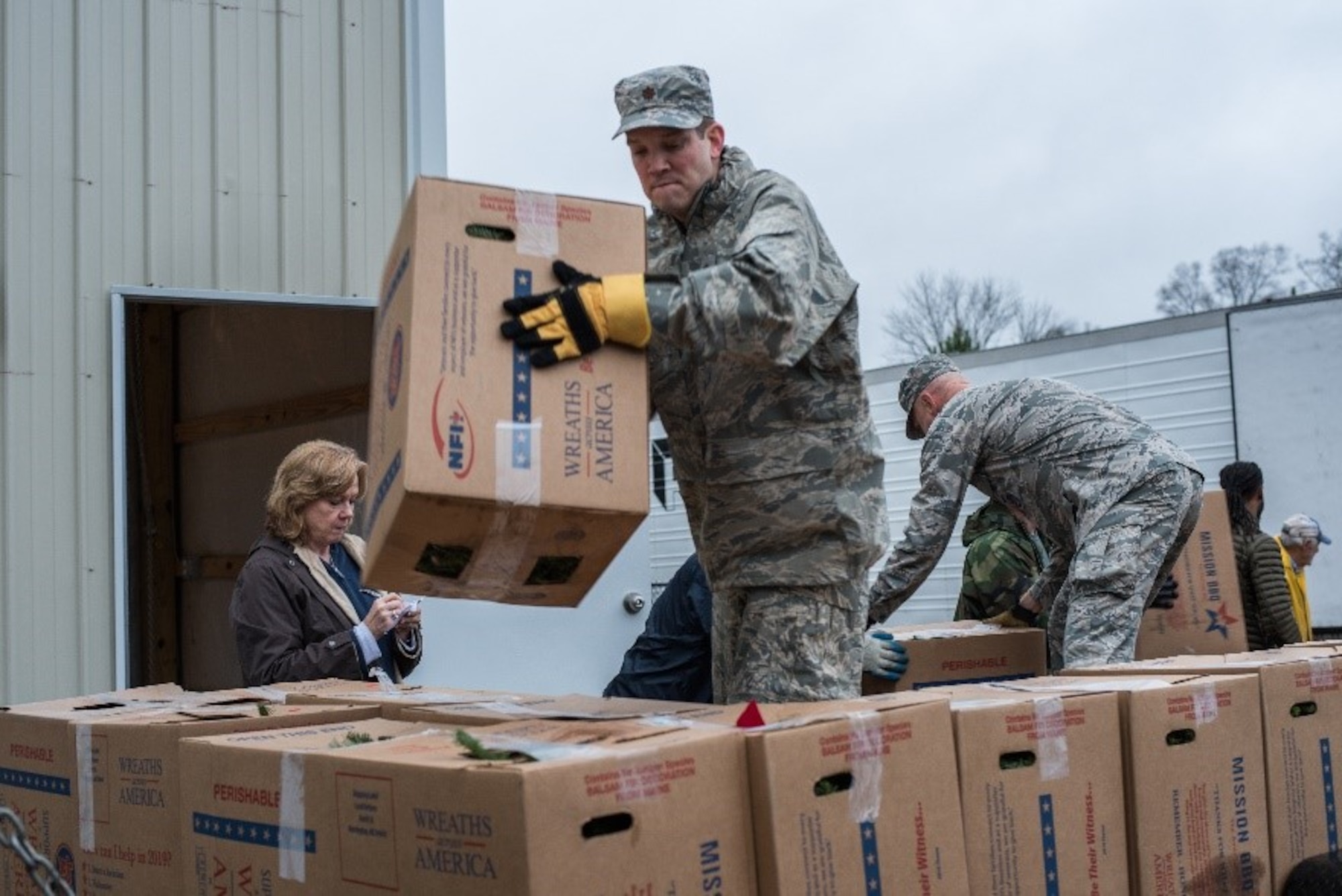 A Maxwell Airmen sorts boxes of wreaths for the Wreaths Across America ceremony Dec. 14, 2018, at the Alabama National Cemetery, in Montevallo, Alabama. Wreaths Across America is an organization that honors our country’s veterans by coordinating wreath laying ceremonies every December. (U.S. Air Force photo by Senior Airman Alexa Culbert)