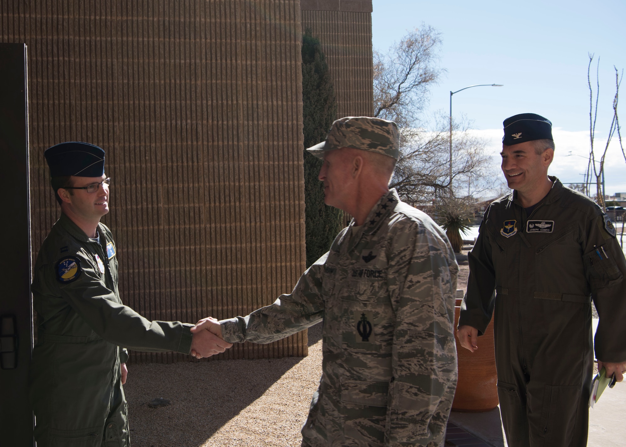 Capt. Ryan Hagener, 49th Wing Commander’s Action Group member, greets Air Force Vice Chief of Staff Gen. Stephen Wilson and Col. Joseph Campo, 49th Wing commander, during a tour of Holloman Air Force Base, N.M., November 30. Wilson received a tour of Holloman after officiating a retirement ceremony for a former enlisted aid. (U.S. Air Force photo by Staff Sgt. BreeAnn Sachs)