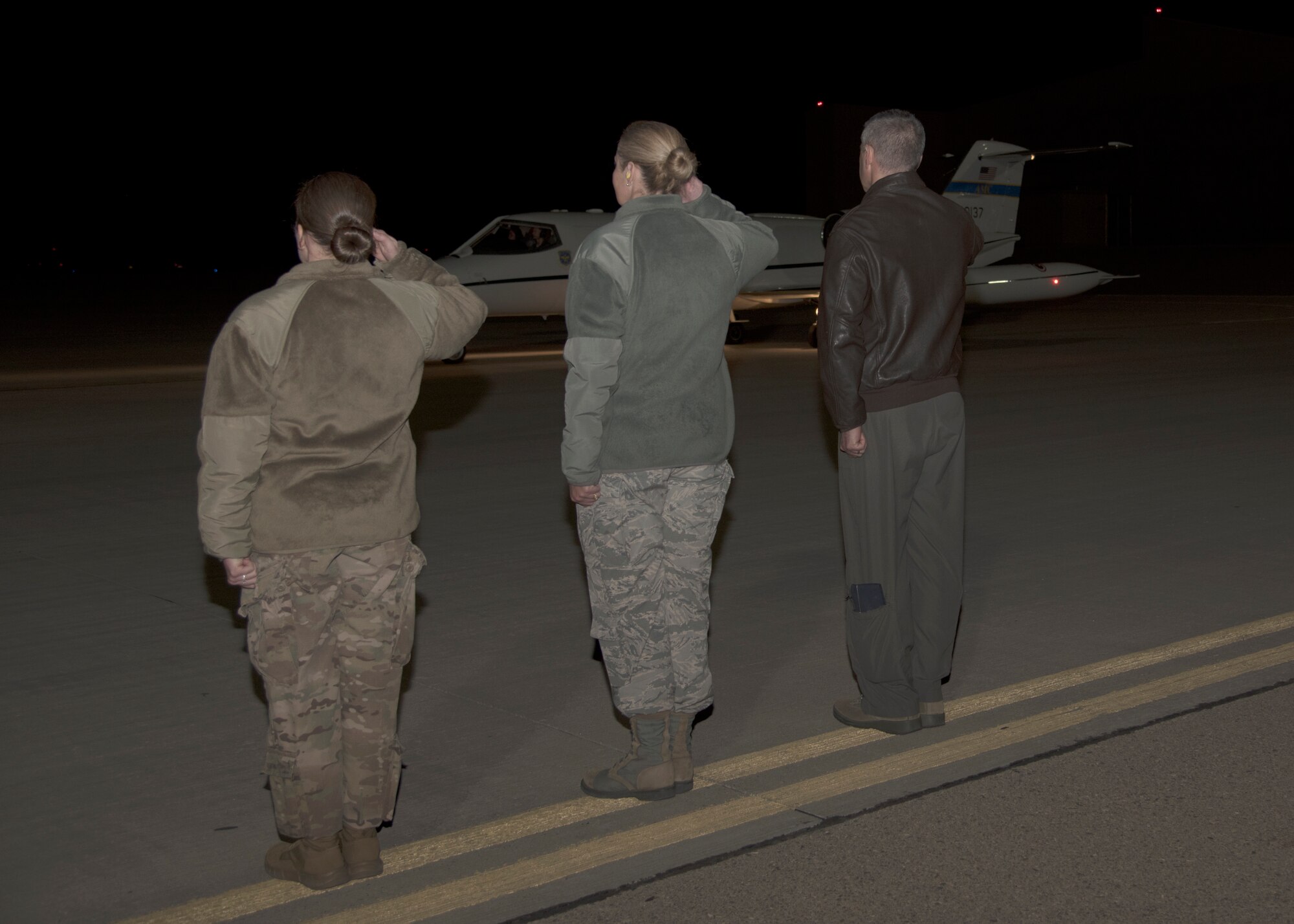 (From left to right) Tech. Sgt. Whitney O’Neill, 49th Wing protocol specialist; Chief Master Sgt. Sarah Esparza, 49th Wing command chief and Col. Joseph Campo, 49th Wing commander, salute as Air Force Vice Chief of Staff Gen. Stephen Wilson arrives on Holloman Air Force Base, N.M., November 29. Wilson received a tour of Holloman after officiating a retirement ceremony for a former enlisted aide. (U.S. Air Force photo by Airman 1st Class Kindra Stewart)