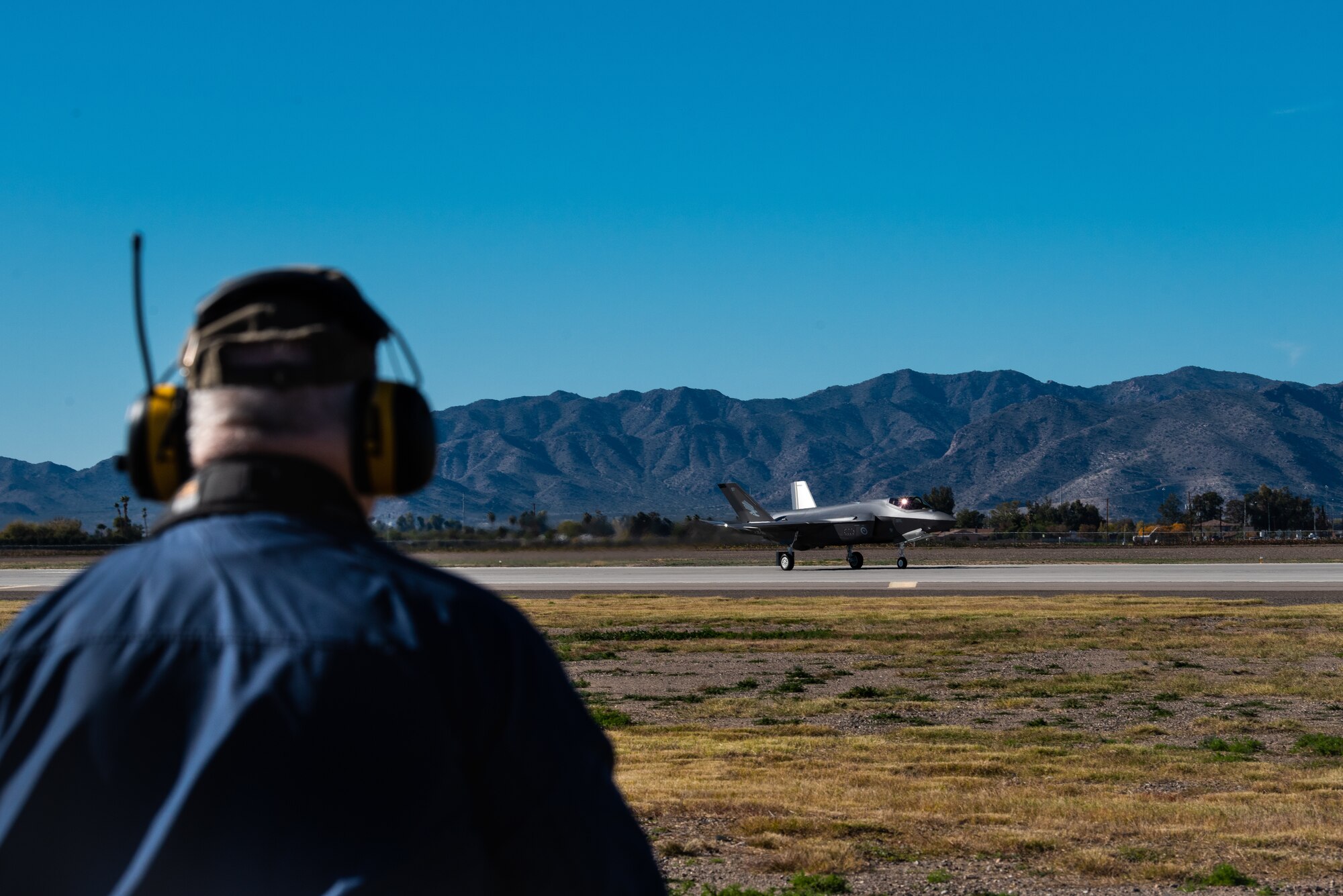 Harvey Brugger, 56th Operations Support Squadron air traffic controller, watches an F-35A Lightning II taxi down the runway, Dec. 13, 2018, at Luke Air Force Base, Ariz.