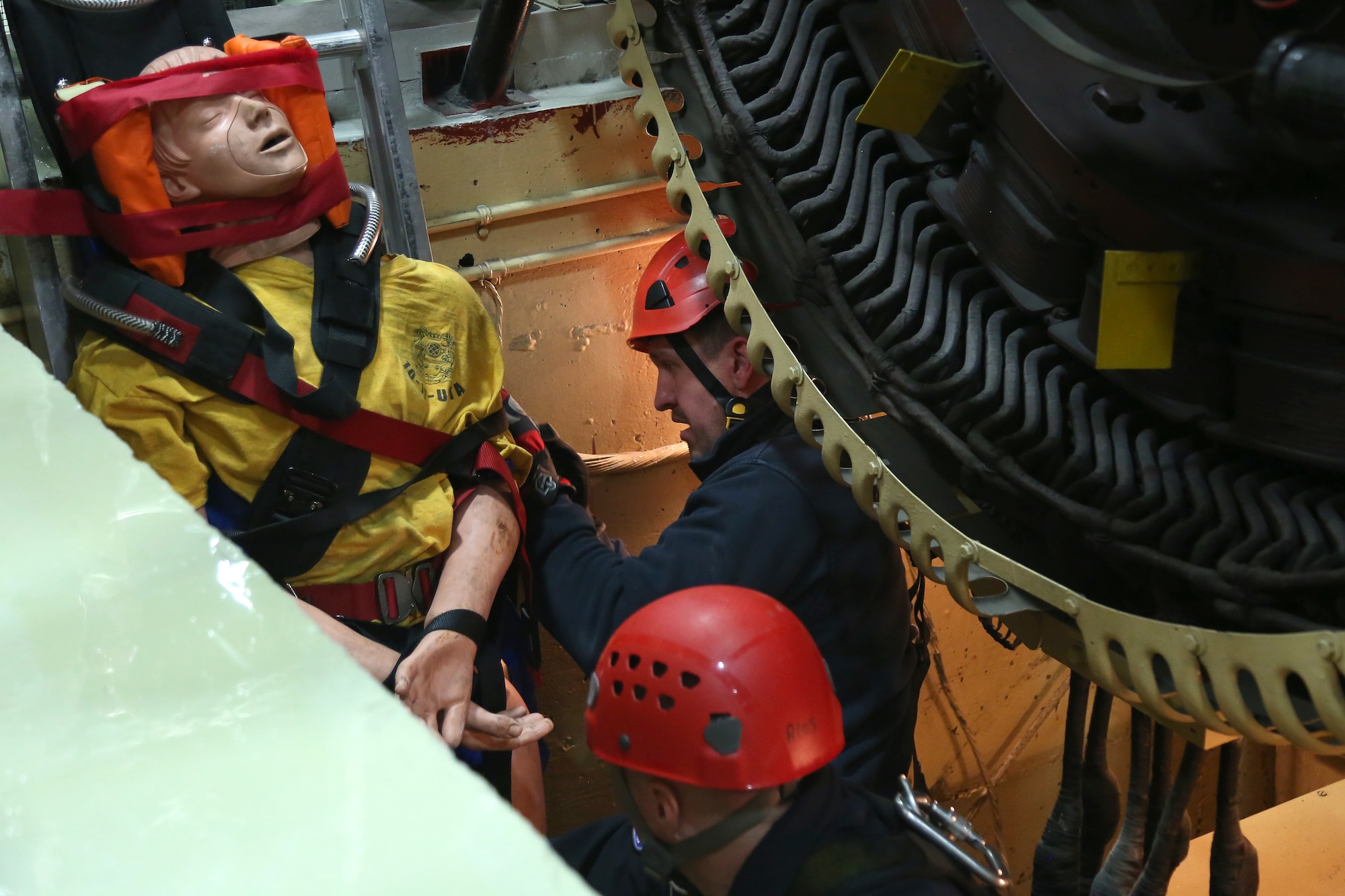 Joint Base Lewis-McChord first responders lift a simulated patient out of a generator pit during confined space rescue training at the Western Air Defense Sector Nov. 11, 2018, on Joint Base Lewis-McChord, Washington. The fire fighters were able to retrieve the patient in less than 40 minutes from the time of the call. (U.S. Air National Guard photo by Master Sgt. Tim Chacon)