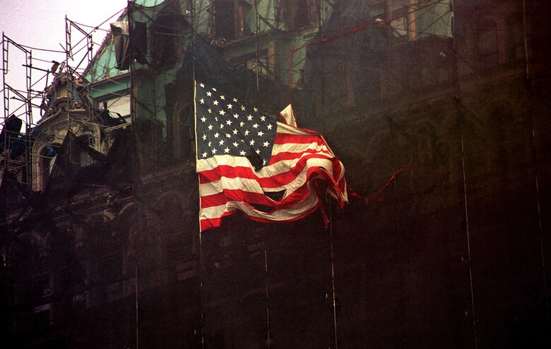 An American flag waves at Ground Zero, formerly the World Trade Center, New York City, N.Y., Sept. 14, 2001.