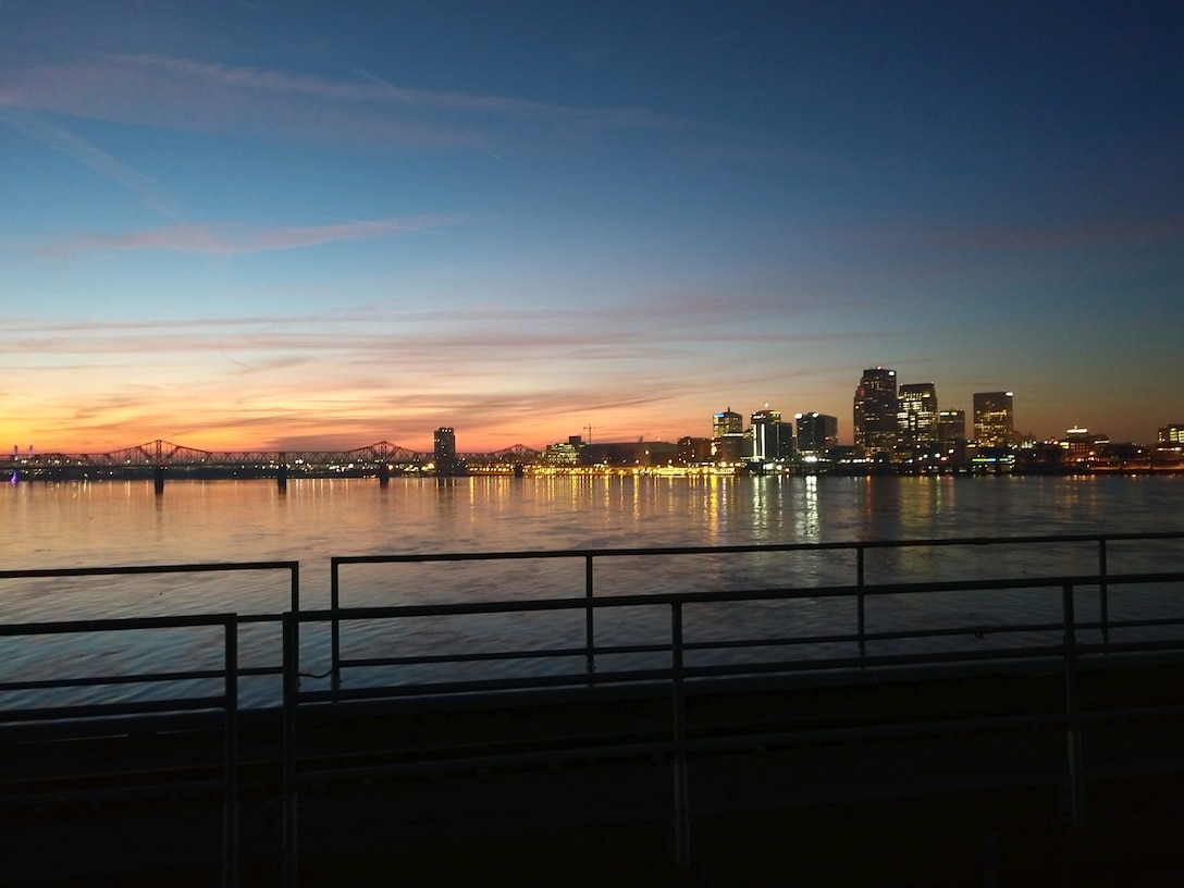 McAlpine Locks and Dam maintenance mechanic captures the morning sun over the city of Louisville. (USACE photo by CJ Bostock)