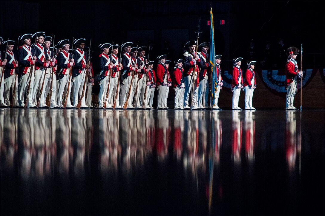 Soldiers stand in a row during a retirement ceremony.