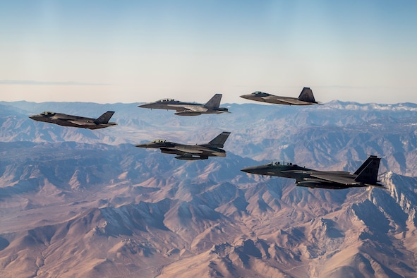 An F-35 and F-16 from Edwards Air Force Base are joined by an F-15E and F-22 from the 422nd Test and Evaluation Squadron out of Nellis Air Force Base, Nevada, along with a Navy F-18 from Air Test and Evaluation Squadron 31 out of Naval Air Weapons Station China Lake, California, Dec. 31. (U.S. Air Force photo by Ethan Wagner)