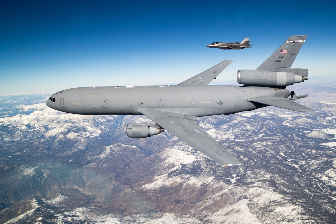 A KC-10 Extender aerial refueling tanker from Travis Air Force Base, California, flies alongside an F-35 Lightning II from the 461st Flight Test Squadron as part of the fourth Orange Flag test event this year, Dec. 13. (U.S. Air Force photo by Ethan Wagner)