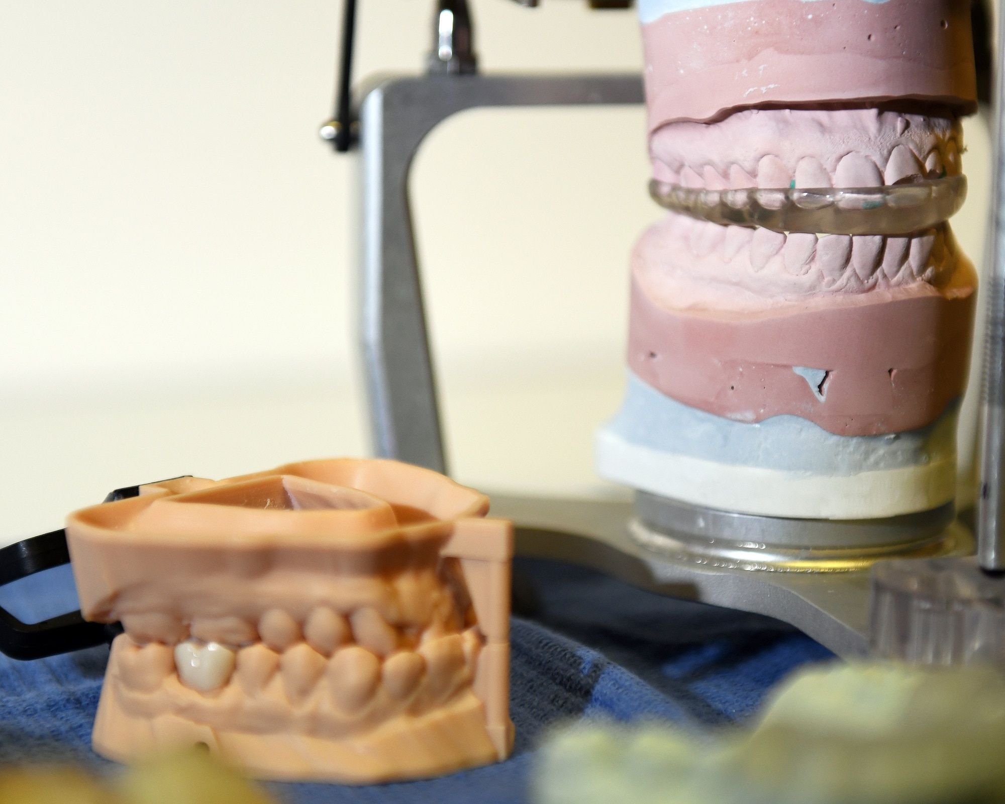 A Formlabs Form2 printer operated by Airmen with the 60th Dental Squadron prints a dental guard at Travis Air Force Base, California, Dec. 17, 2018. The printer was purchased with Squadron Innovation Funds provided by the U.S. Air Force Chief of Staff, Gen. David Goldfein. The Form2 printer is a stereolithographic 3D multiple resin printer designed for use in dentistry. The innovative printer reduces the manning hours required to produce dental prosthetics by up to 85 percent, cutting hands-on production time from three hours to 30 minutes. (U.S. Air Force photo by Louis Briscese)