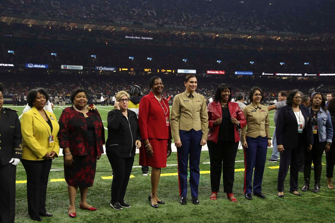 Judge Tamia Gordon, a former U.S. Marine Corps major, center right, gathers with fellow Marines for a "100 Years of Women" ceremony on the football field at the Mercedes-Benz Superdome in New Orleans, Nov. 24, 2018. 


“I am grateful the Marine Corps continues to invest in the Bayou Classic each year,” said Gordon. "This worthwhile investment builds bridges with prospects and influencers in the African American community." 


Gordon currently serves as the associate chief administrative law judge for the Department of Health and Human Services, Office of Medicare Hearings and Appeals, at the New Orleans Field Office. (U.S. Marine Corps photo by Sgt. Nathaniel Cray/Released)