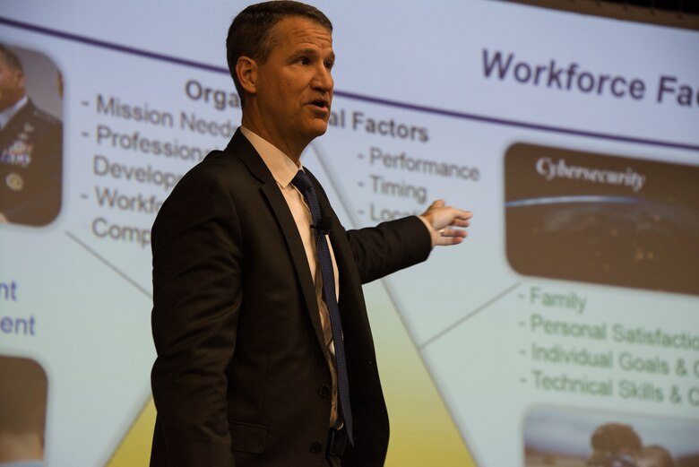 One person speaking in front of a screen.