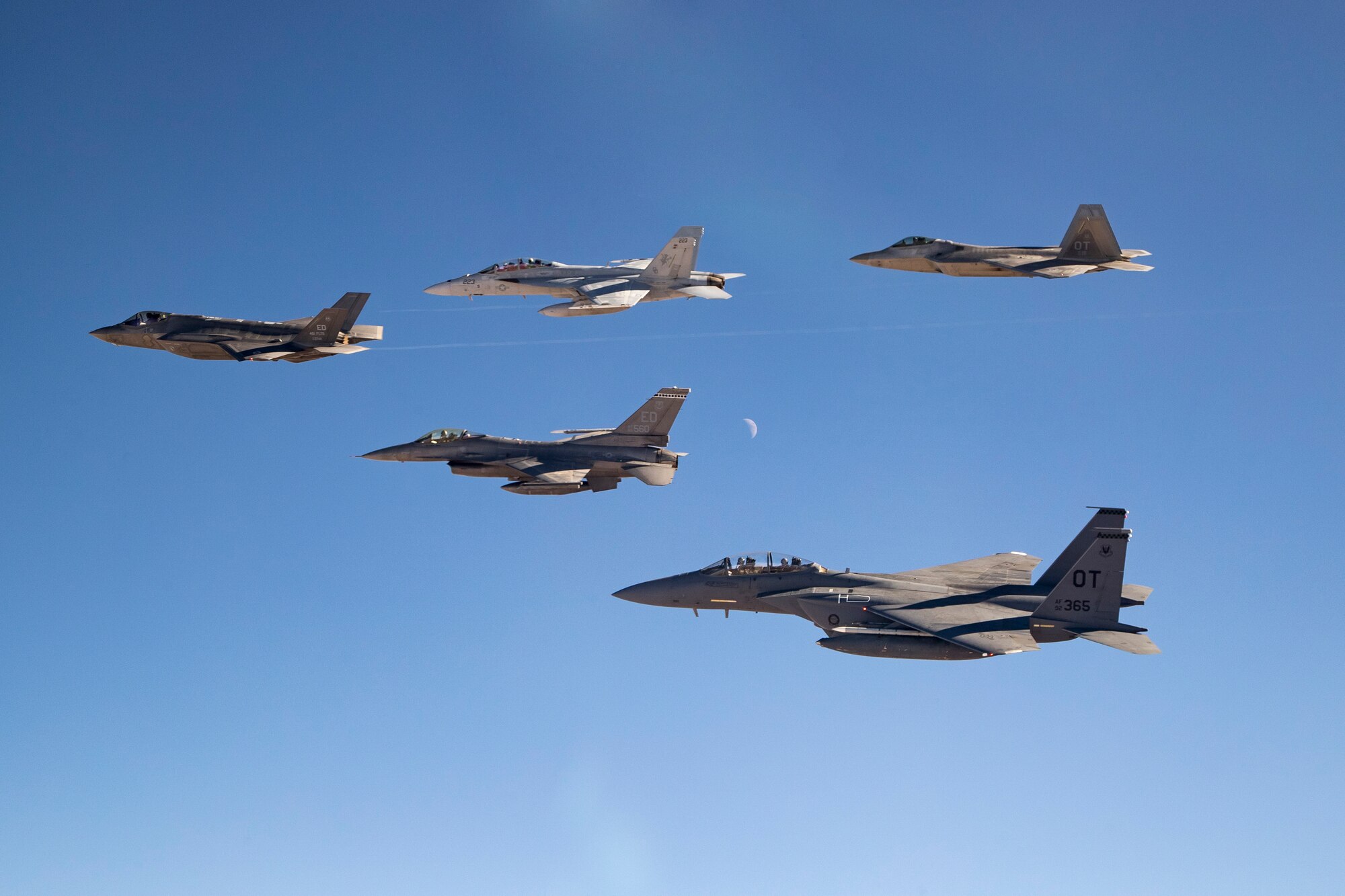 An F-35 and F-16 from Edwards Air Force Base are joined by an F-15E and F-22 from the 422nd Test and Evaluation Squadron out of Nellis Air Force Base, Nevada, along with a Navy F-18 from Air Test and Evaluation Squadron 31 out of Naval Air Weapons Station China Lake, California, Dec. 31. (U.S. Air Force photo by Ethan Wagner)