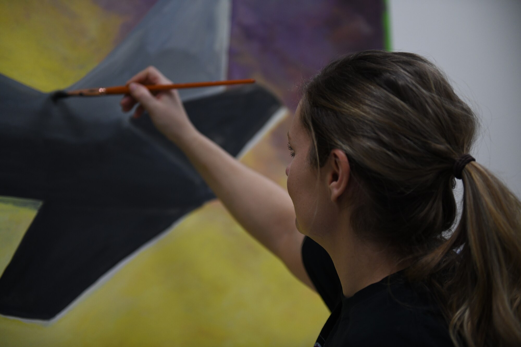 Tech. Sgt. Maralene Scarpino, an aircraft maintenance specialist assigned to the 910th Maintenance Squadron, paints a mural in the 910th Maintenance Group's heritage room at Youngstown Reserve Station, Dec. 17, 2018.