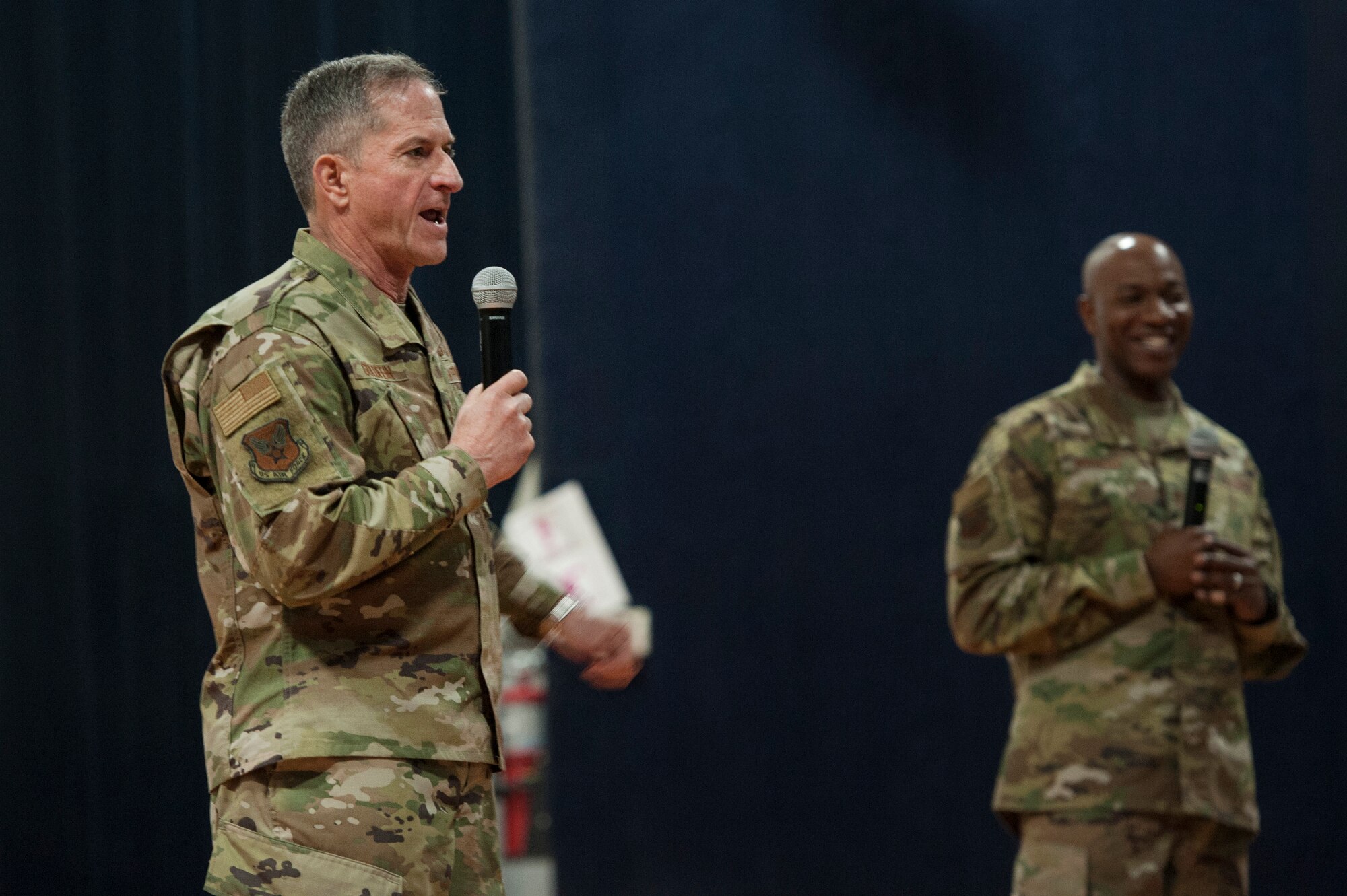 U.S. Air Force Chief of Staff Gen. David L. Goldfein and Chief Master Sgt. of the Air Force Kaleth O. Wright answer questions from Airmen during a base-wide “all call” at Al Udeid Air Base, Qatar, Dec. 19, 2018. During the all call, Goldfein said his leadership team has been pushing decision authority and resources down to the squadron level while simultaneously removing irritants and obstacles to warfighting readiness. (U.S. Air Force photo by Tech. Sgt. Christopher Hubenthal)