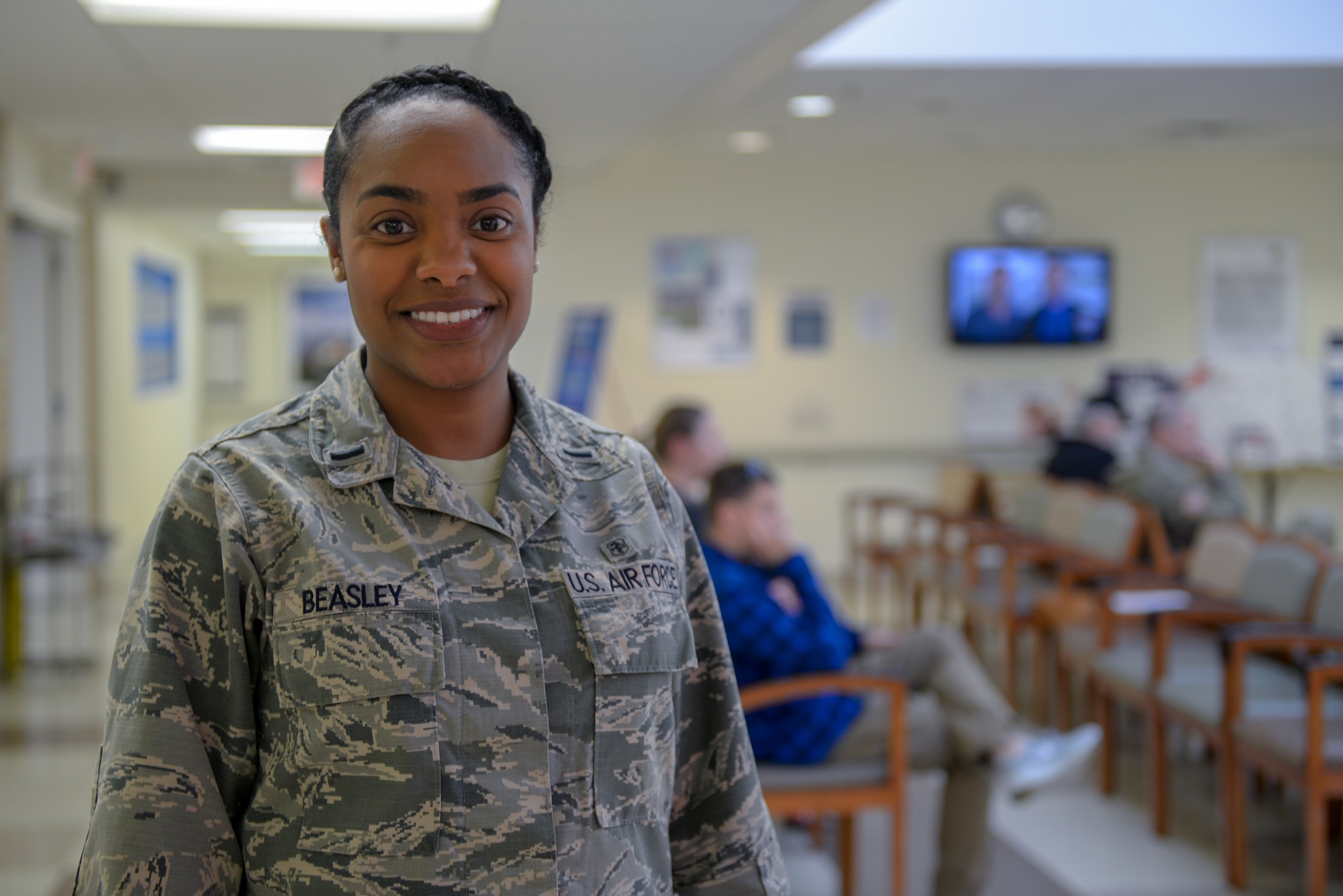 U.S. Air Force 1st Lt. Valyn Beasley, 55th Medical Group practice manager healthcare administer, poses for a photo Dec. 19, 2018, at the Ehrling Bergquist Clinic, Bellevue, Nebraska. Beasley was recently admitted into the National Coalition of 100 Black Women of Omaha, a non-profit advocacy organization designed to increase the economic growth, health & wellness, educational, political and social gains for women of color, in recognition for her community service. (U.S. Air Force photo by Tech. Sgt. Rachelle Blake)