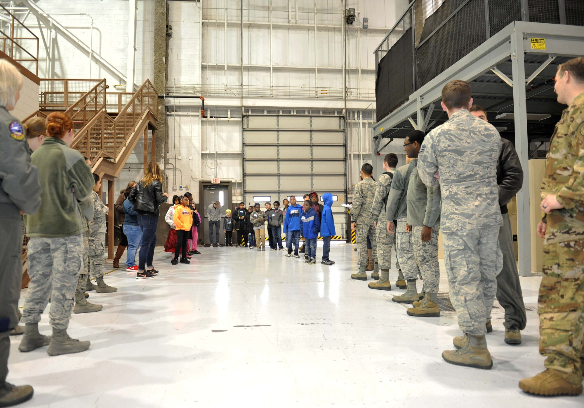 Volunteer Airmen wait to meet children from Big Brothers Big Sisters Dec. 19, 2018, at McConnell Air Force Base, Kansas. Operation Santa brought kids from BBBS to McConnell to spend some time with Airmen, build gingerbread houses and receive presents. (U.S. Air Force photo by Staff Sgt. David Bernal Del Agua)