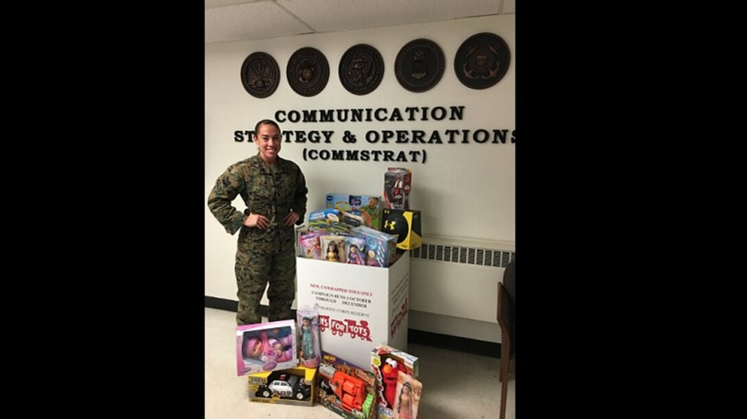 Staff Sgt. Melissa Marnell, a combat photographer with MCBQ CommStrat, collects toys each year for Toys for Tots.