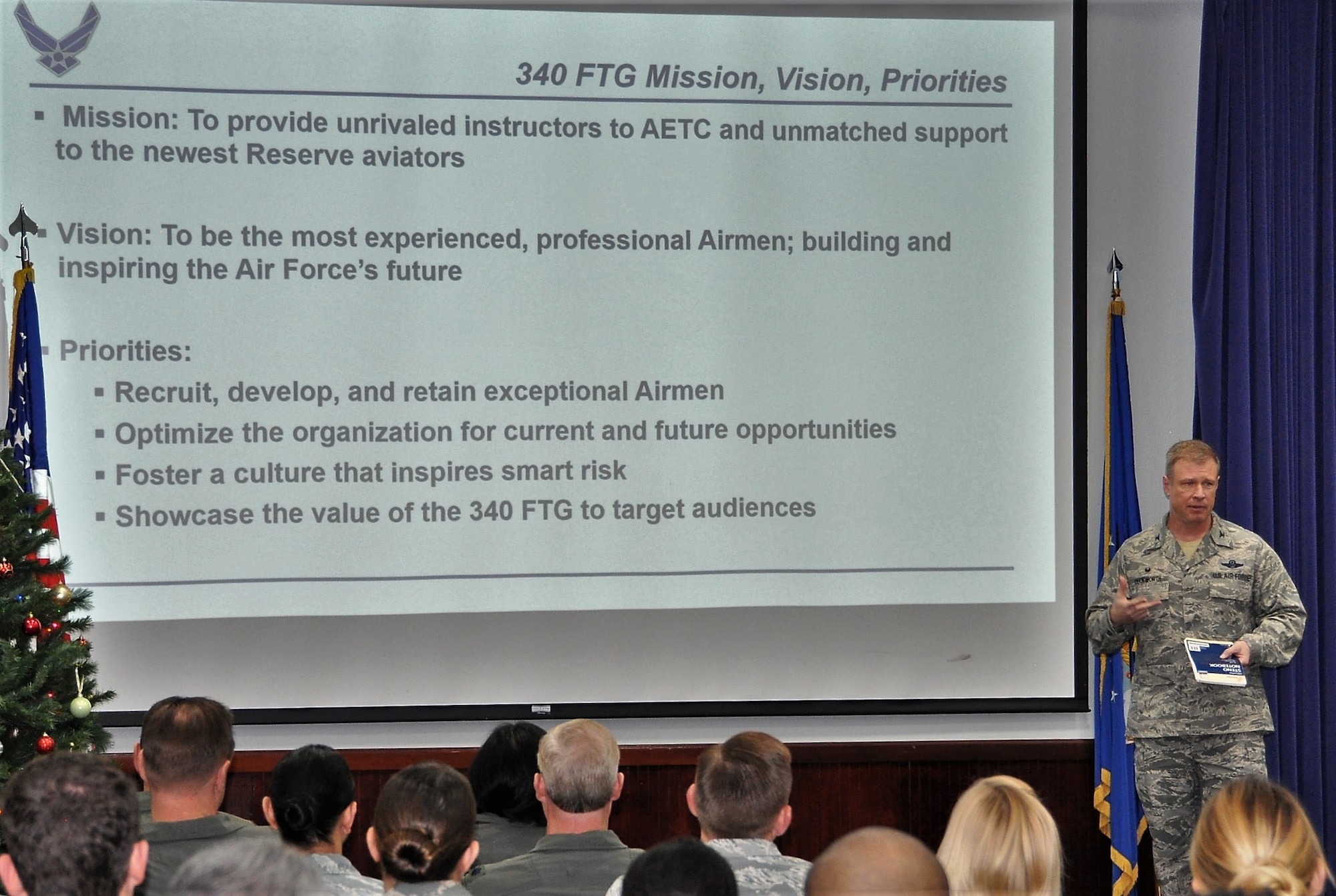 Col. Allen Duckworth, 340th Flying Training Group commander, delivers opening remarks during the Dec. 13-14 mandatory unit training assembly (or MUTA) held at Joint Base San Antonio, Texas. (U.S. Air Force photo by Tech. Sgt. Brianne Blackstock)