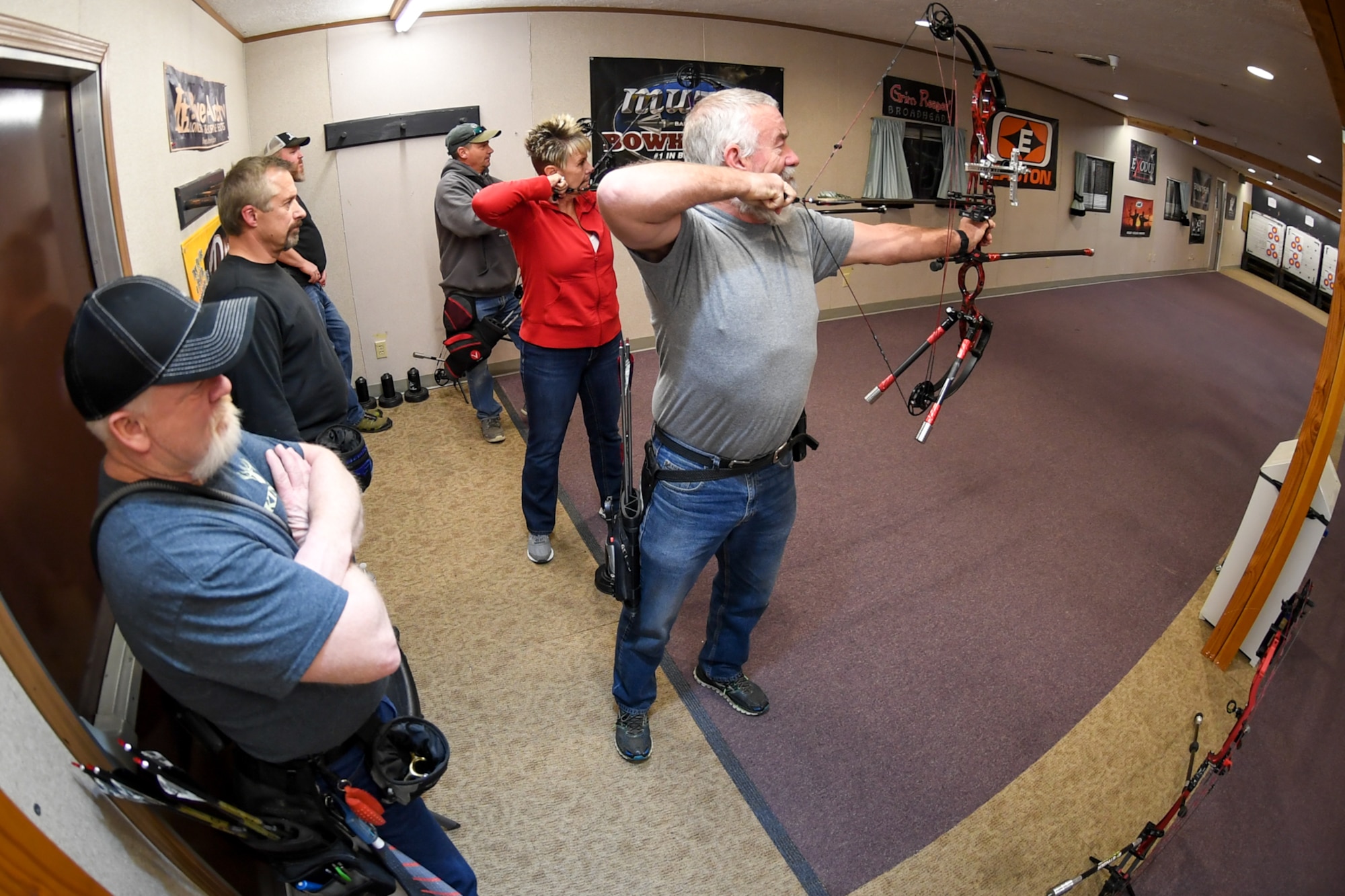 Hill Archery Club members take turns shooting their compound bows during a club league night Dec. 13, 2018, at Hill Air Force Base, Utah. The 20-yard indoor range at Hill’s archery clubhouse houses five lanes for shooting. There are also four different outdoor ranges. (U.S. Air Force photo by Cynthia Griggs)