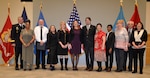 Army Brig. Gen. Mark Simerly, DLA Troop Support commander, poses with 11 employees during a retirement ceremony at DLA Troop Support Dec. 17, 2018 in Philadelphia.