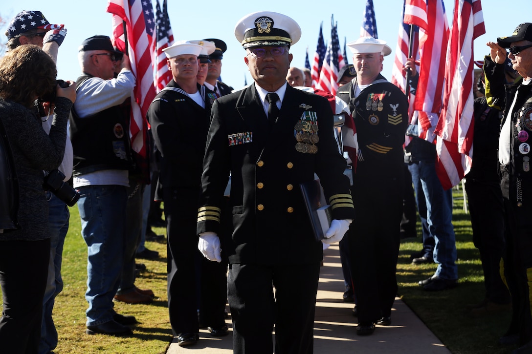 Cmdr. Don Biadog, Marine Corps Air Station Miramar chaplain, escorts Raymond Chavez’s casket to the Miramar National Cemetery in San Diego, Dec. 13. Chavez was aboard the USS Condor during the attack on Pearl Harbor Dec. 7, 1941 and passed away on Nov. 21, 2018 as the oldest veteran Pearl Harbor survivor at the age of 106. (U.S. Marine Corps photo by Sgt. Jake McClung)