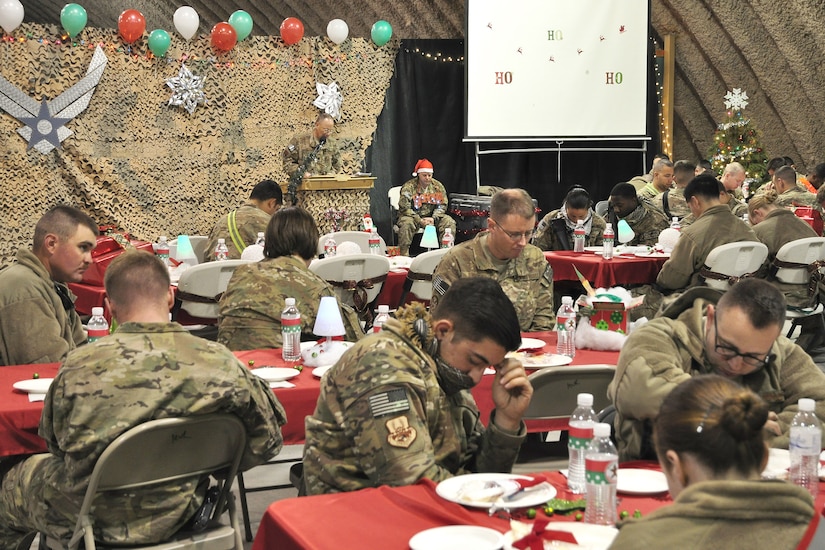 An Army chaplain prays.