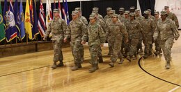 FORT KNOX, Ky. – Soldiers from the 1st Theater Sustainment Command Blue Team march into the Sadowski Center for their redeployment ceremony, Dec. 12. The team deployed to Kuwait in December and spent six-months there, traveling to various countries in the Middle East, in support of their mission. (U.S. Army photo by Mr. Brent Thacker)