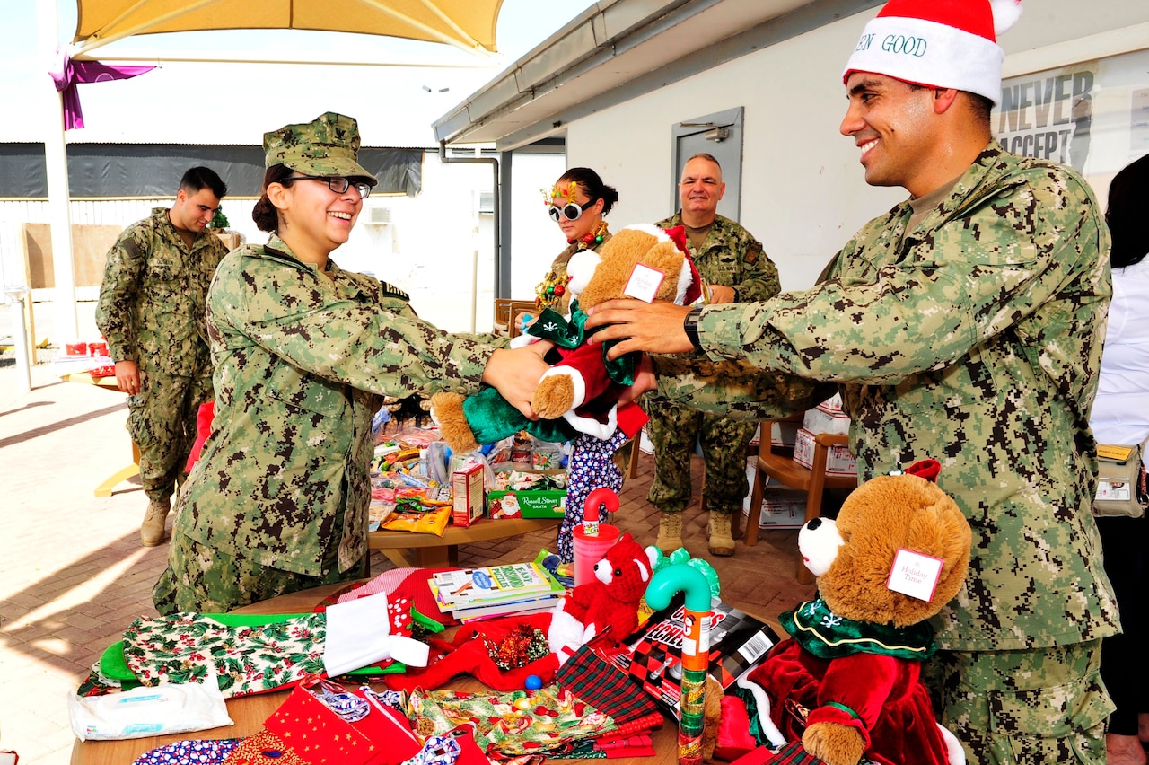 Sailors exchange gifts.