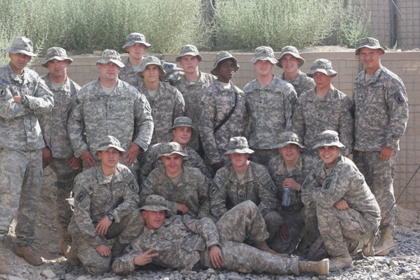 A group of soldiers pose for a photo.