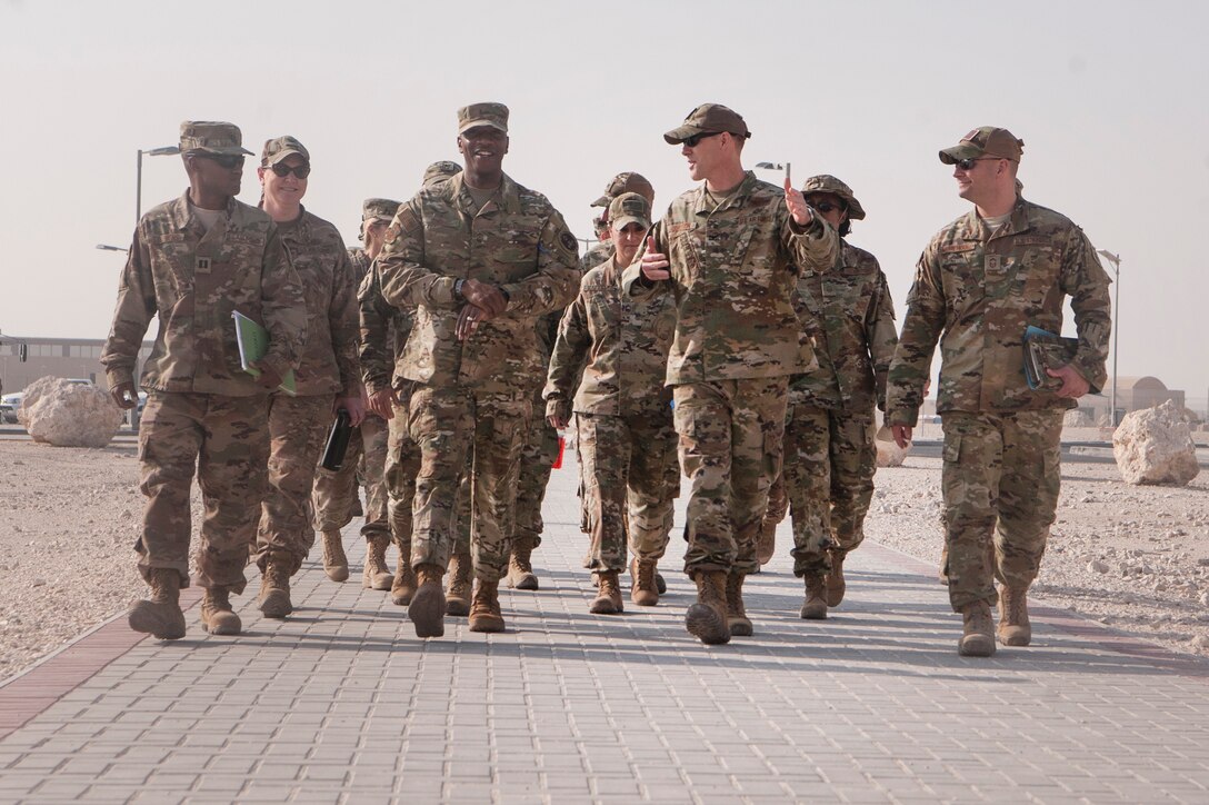 Chief Master Sgt. of the Air Force Kaleth O. Wright (center left) tours the Blatchford Preston Complex (BPC) dormitories with Col. Benjamin Jonsson, 379th Air Expeditionary Wing vice commander (center right), and other base leaders, at Al Udeid Air Base, Qatar, Dec. 20, 2018. Wright toured a dormitory and recognized Airmen with the cleanest rooms. (U.S. Air Force photo by Tech. Sgt. Christopher Hubenthal)