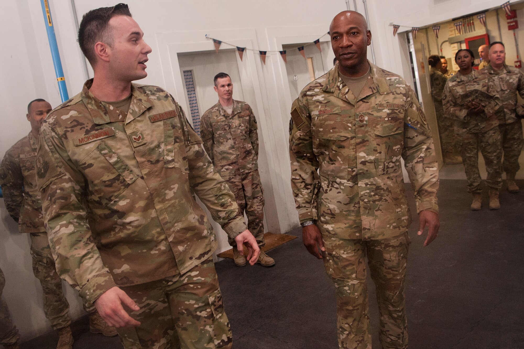 Senior Airman Kane McKinnon, 379th Expeditionary Maintenance Squadron crew chief, gives Chief Master Sgt. of the Air Force Kaleth O. Wright a tour of the squadron’s wheel and tire shop at Al Udeid Air Base, Qatar, Dec. 20, 2018. McKinnon represented his squadron during the site visit and was recognized by Wright for his exceptional performance as a crew chief. (U.S. Air Force photo by Tech. Sgt. Christopher Hubenthal)