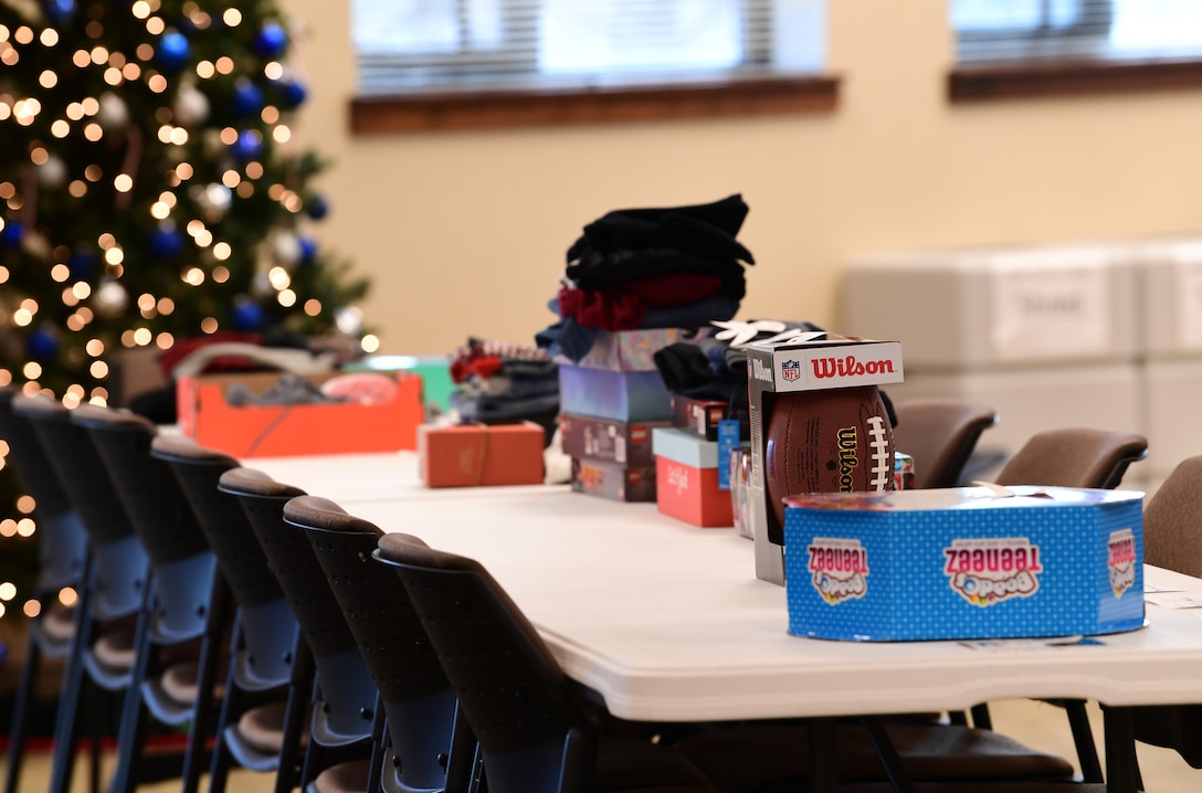 Gifts donated to families through the Angel Tree program are arranged on the tables according to a number assigned to each family for anonymity at Buckley Air Force Base, Colorado, Dec. 19, 2018.