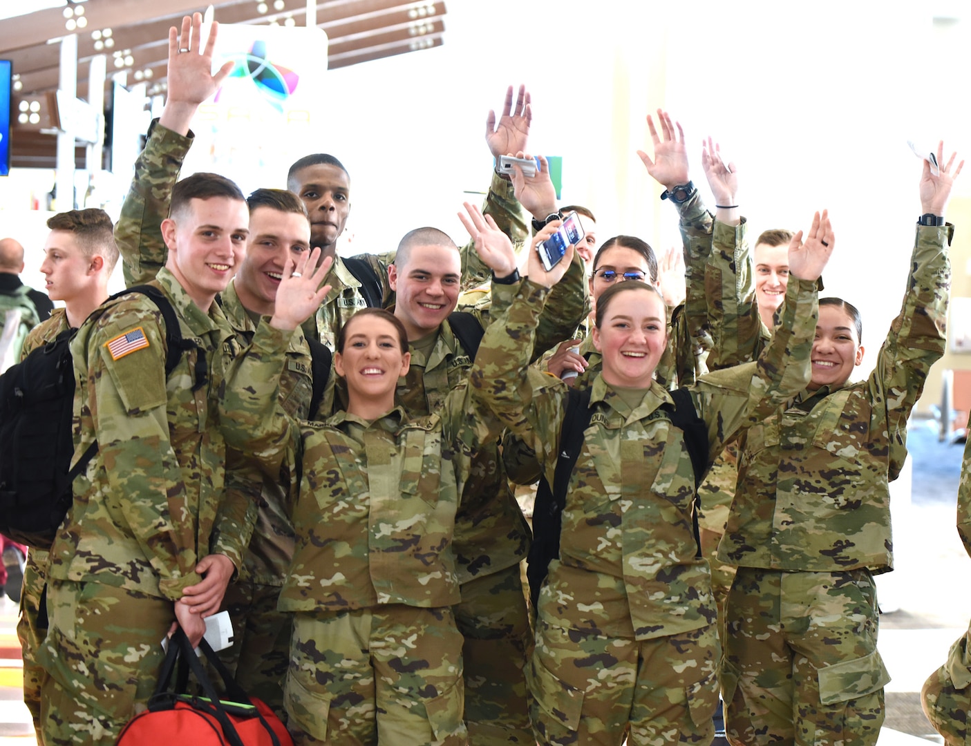 Army Soldiers attending medical Advanced Individual Training  at the U.S. Army Medical Department Center and School Health Readiness Center of Excellence, or AMEDDC&S HRCoE, at Joint Base San Antonio-Fort Sam Houston show their holiday cheer before boarding an airplane at the San Antonio International Airport.