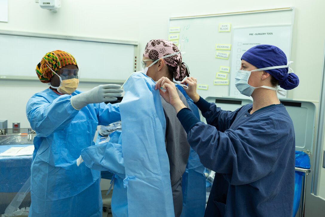 U.S. service members assigned to a joint surgical team prepare for surgery at Joint Base-Langley-Eustis, Virginia, Dec. 11, 2018.