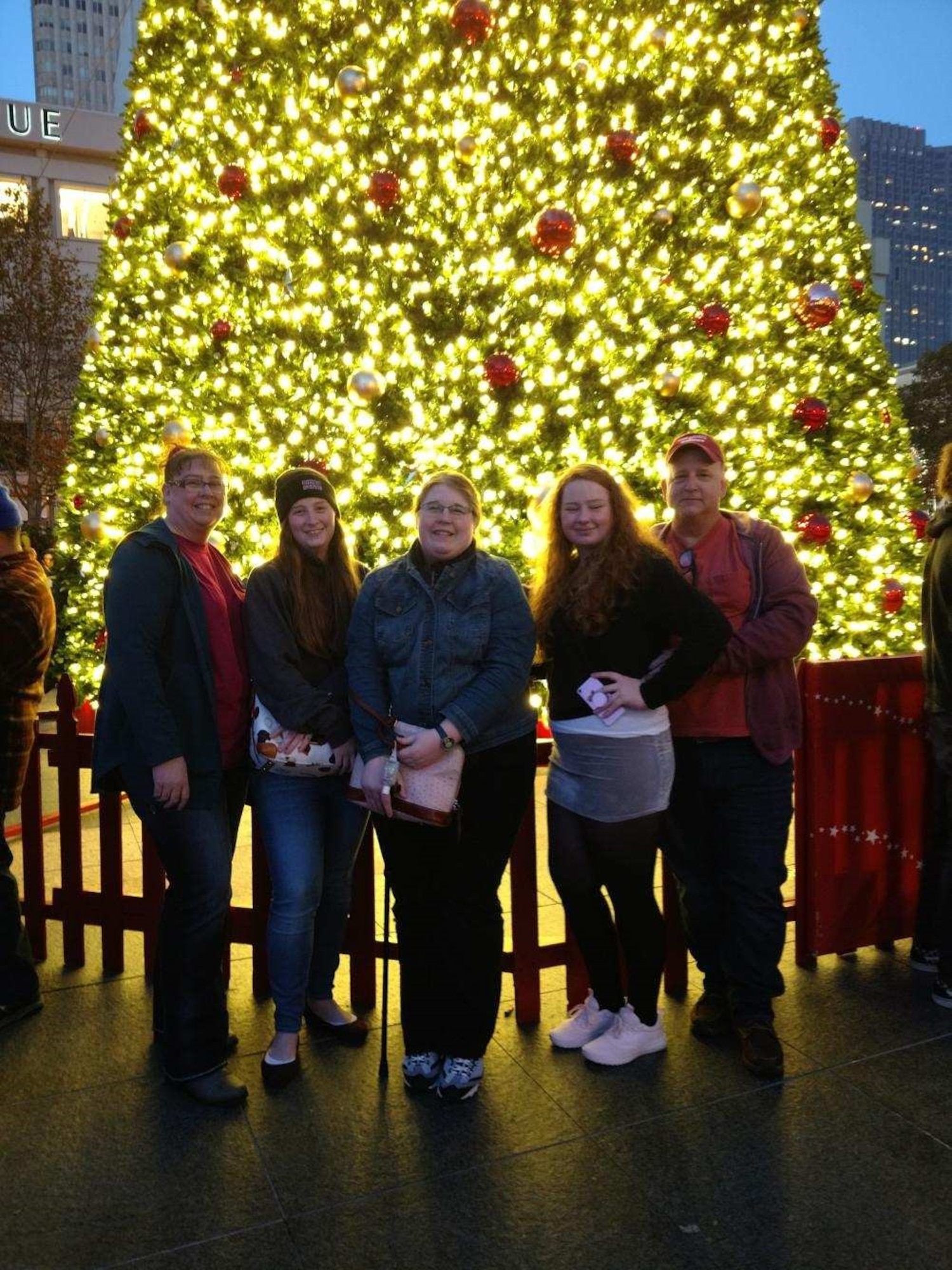 Stacey, Tiffany, Mellisa, Samantha and Patrick Pipkin pose for a photo in front of the Christmas tree in the center of Union Square during an outing to San Francisco, Calif., Dec. 1, 2018.  The trip was also the first time Sam proved to herself and her family that she could walk up and down the stairs at the Fairmont Hotel on Nob Hill. (Courtesy photo)
