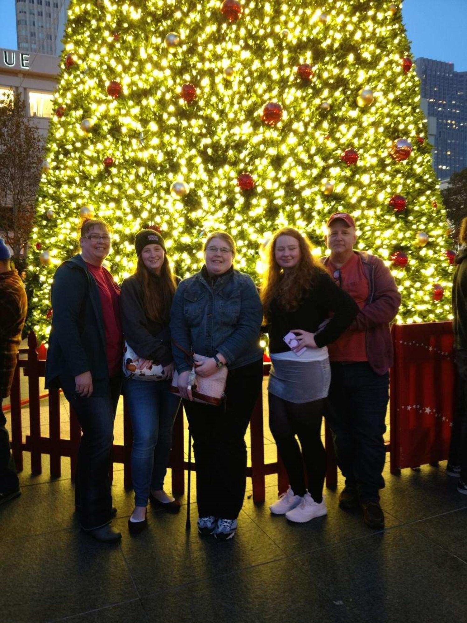 Stacey, Tiffany, Mellisa, Samantha and Patrick Pipkin pose for a photo in front of the Christmas tree in the center of Union Square during an outing to San Francisco, Calif., Dec. 1, 2018.  The trip was also the first time Sam proved to herself and her family that she could walk up and down the stairs at the Fairmont Hotel on Nob Hill. (Courtesy photo)