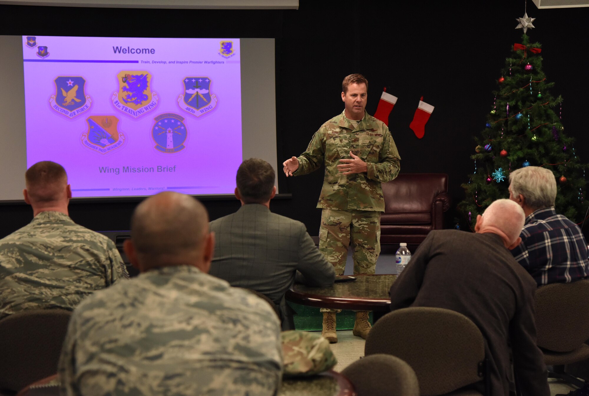 U.S. Air Force Col. Lance Burnett, 81st Training Wing vice commander, briefs members of the Governor's Defense Initiative Task Force during a visit to Keesler Air Force Base, Mississippi, Dec. 13, 2018. Keesler hosted the delegation in order to engage in discussion about making Mississippi a more attractive place for Airmen and their families and to attract more defense industry. (U.S. Air Force photo by Kemberly Groue)