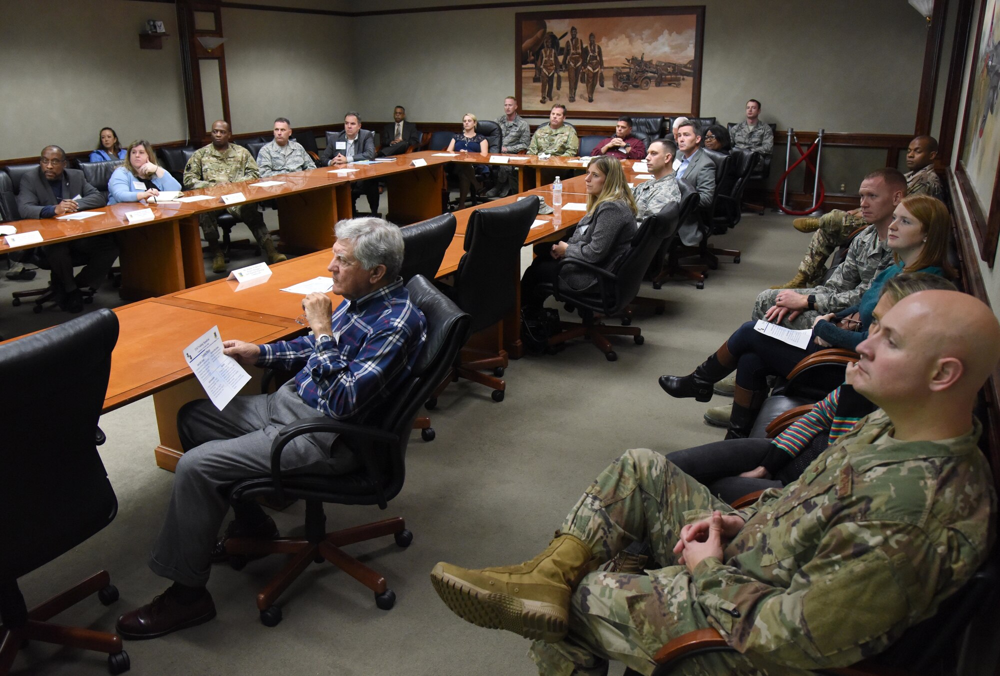 Keesler personnel and members of the Governor's Defense Initiative Task Force attend a 333rd Training Squadron mission brief during a visit to Keesler Air Force Base, Mississippi, Dec. 13, 2018. Keesler hosted the delegation in order to engage in discussion about making Mississippi a more attractive place for Airmen and their families and to attract more defense industry. (U.S. Air Force photo by Kemberly Groue)