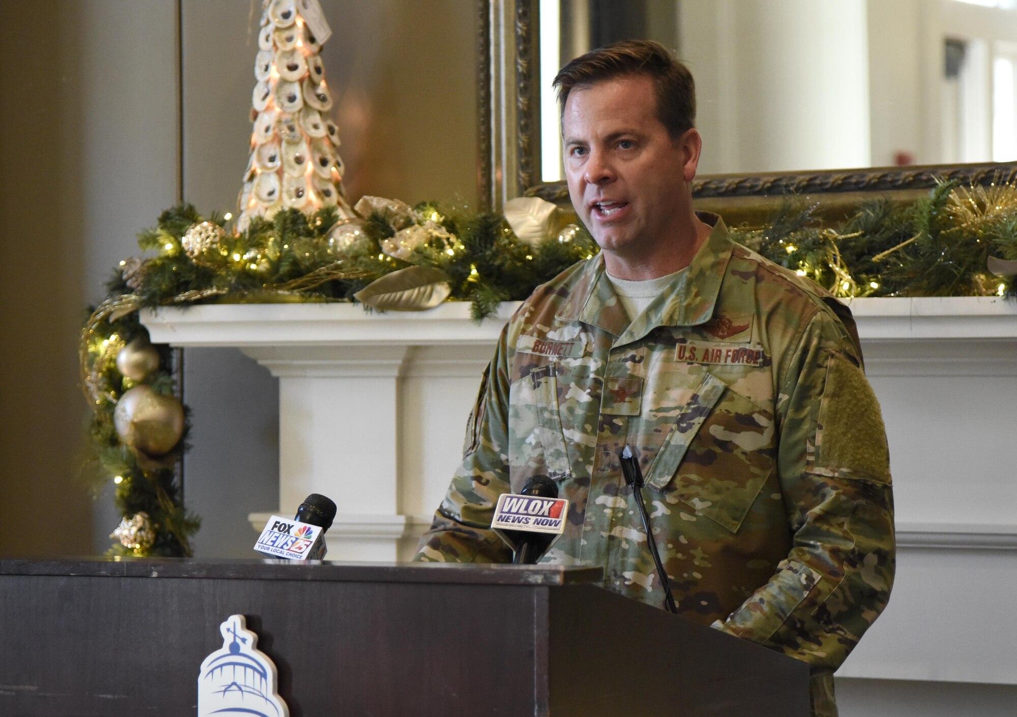 U.S. Air Force Col. Lance Burnett, 81st Training Wing vice commander, delivers remarks during a press conference formally announcing Thunder Over the Sound: The Keesler and Biloxi Air and Space Show at the Biloxi Visitors Center, in Biloxi, Mississippi, Dec. 18, 2018. Burnett was joined by Andrew "Fo Fo" Gilich, Biloxi mayor, and two U.S. Air Force Thunderbird pilots at the press conference which reviewed and confirmed information and acts for the air show and allowed attendees to meet with and ask questions of all speakers. (U.S. Air Force photo by Kemberly Groue)