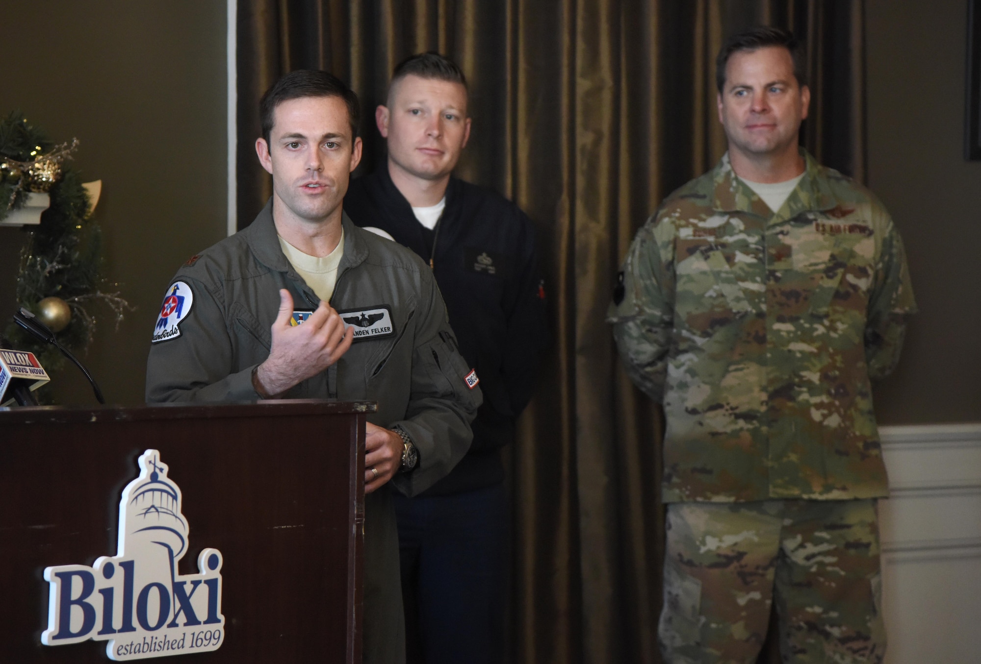 U.S. Air Force Maj. Branden "Ash" Felker, outgoing Thunderbird pilot #8, delivers remarks during a press conference formally announcing Thunder Over the Sound: The Keesler and Biloxi Air and Space Show at the Biloxi Visitors Center, in Biloxi, Mississippi, Dec. 18, 2018. Felker was joined by Keesler and Biloxi leadership at the press conference which reviewed and confirmed information and acts for the air show and allowed attendees to meet with and ask questions of all speakers. (U.S. Air Force photo by Kemberly Groue)