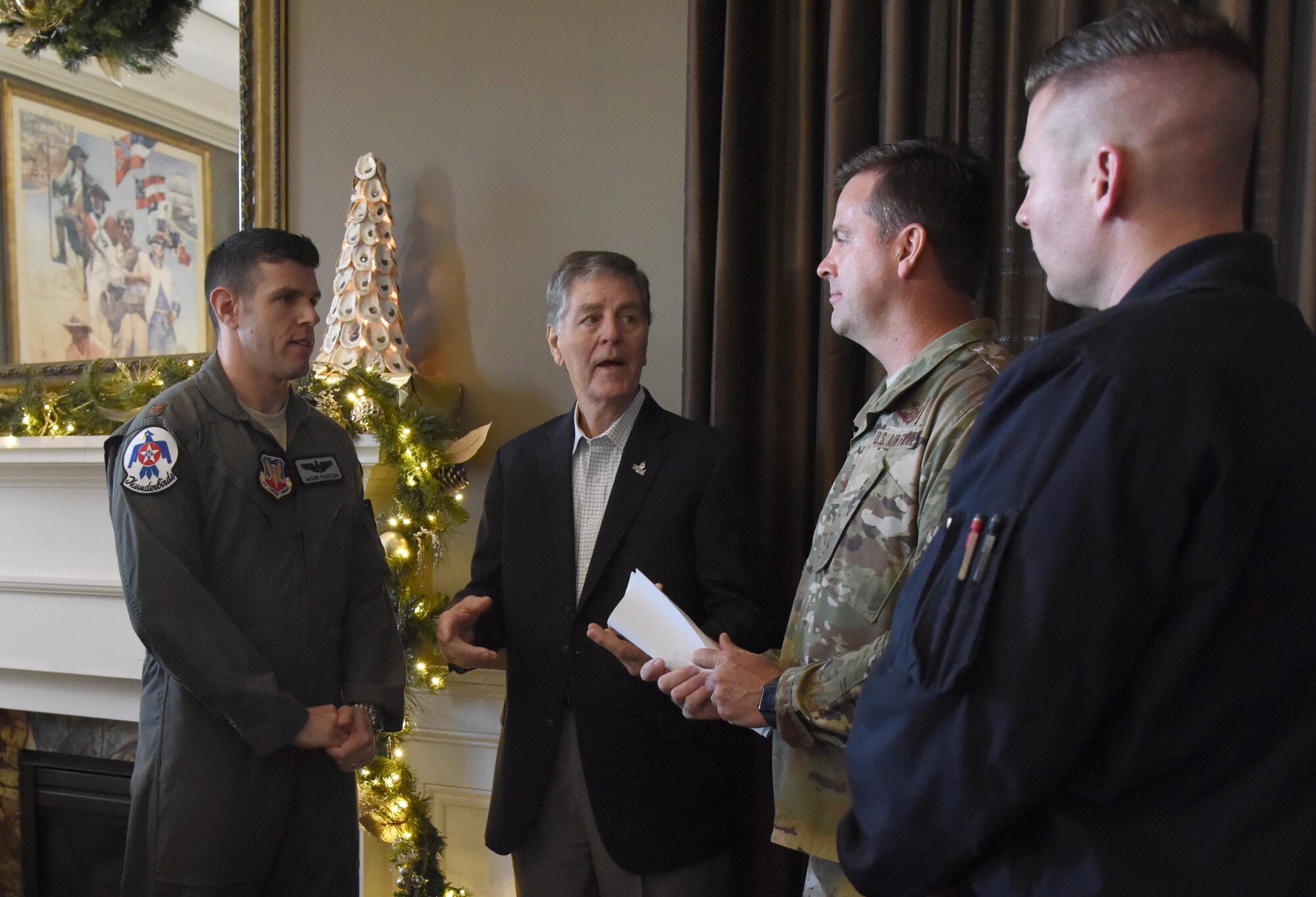 Andrew "Fo Fo" Gilich, Biloxi mayor, speaks with U.S. Air Force Col. Lance Burnett, 81st Training Wing vice commander, and Maj. Jason "Flack" Markzon, inbound Thunderbird pilot #8, during a press conference formally announcing Thunder Over the Sound: The Keesler and Biloxi Air and Space Show at the Biloxi Visitors Center, in Biloxi, Mississippi, Dec. 18, 2018. The press conference reviewed and confirmed information and acts for the air show and allowed attendees to meet with and ask questions of all speakers. (U.S. Air Force photo by Kemberly Groue)