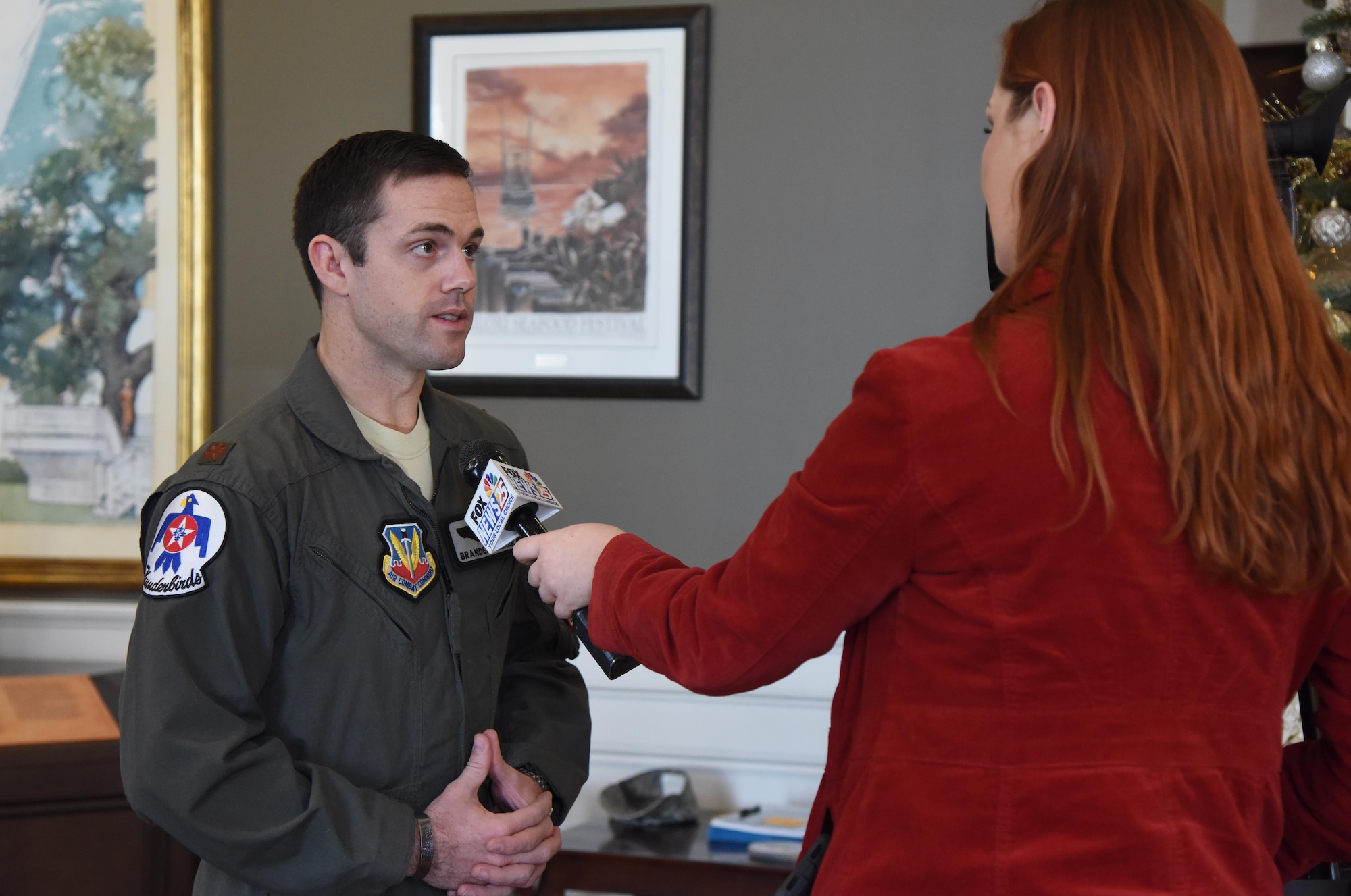 U.S. Air Force Maj. Branden "Ash" Felker, outgoing Thunderbird pilot #8, answers interview questions during a press conference formally announcing Thunder Over the Sound: The Keesler and Biloxi Air and Space Show at the Biloxi Visitors Center, in Biloxi, Mississippi, Dec. 18, 2018. Felker was joined by Keesler and Biloxi leadership at the press conference which reviewed and confirmed information and acts for the air show and allowed attendees to meet with and ask questions of all speakers. (U.S. Air Force photo by Kemberly Groue)