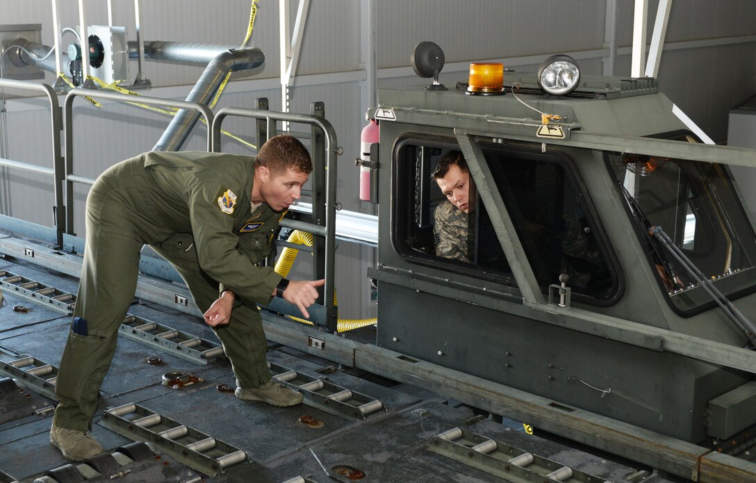 Senior Master Sgt. Patrick Martin trains Staff Sgt. Ryan Olszewski in the operation of a Halvorsten 25K loader, Nov. 8, 2018, at Pease Air National Guard Base, N.H. (U.S. Air National Guard photo by Master Sgt. Thomas Johnson)