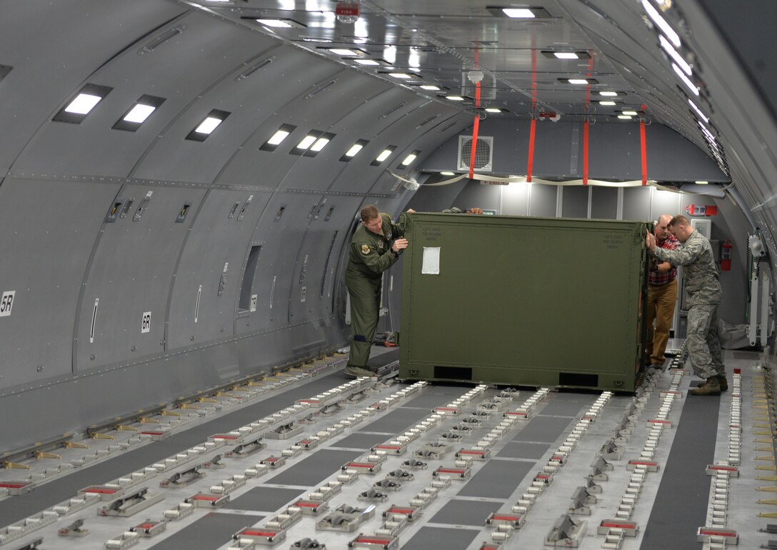 Senior Master Sgt. Patrick Martin and Senior Airman Andrew Poole position a pallet in the Boeing KC-46A Fuselage Trainer, Nov. 7, 2018, at Pease Air National Guard Base, N.H. (Photo by Master Sgt. Thomas Johnson, 157th ARW Public Affairs)